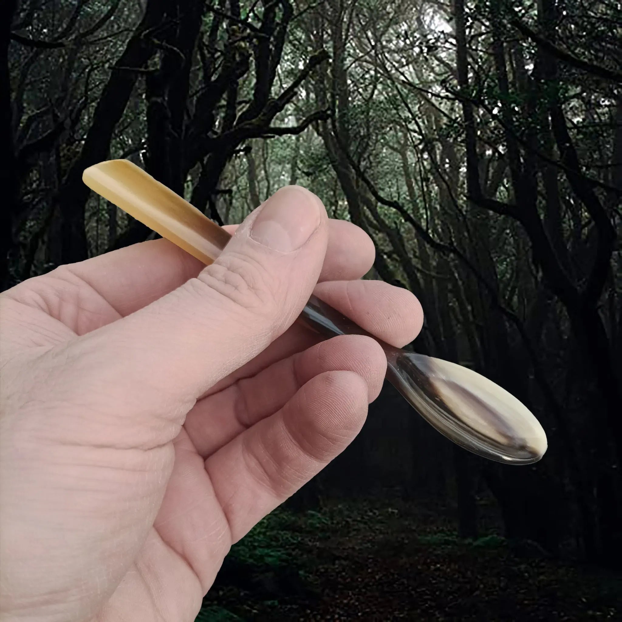 Handmade Horn Egg Spoon in Hand - Side View