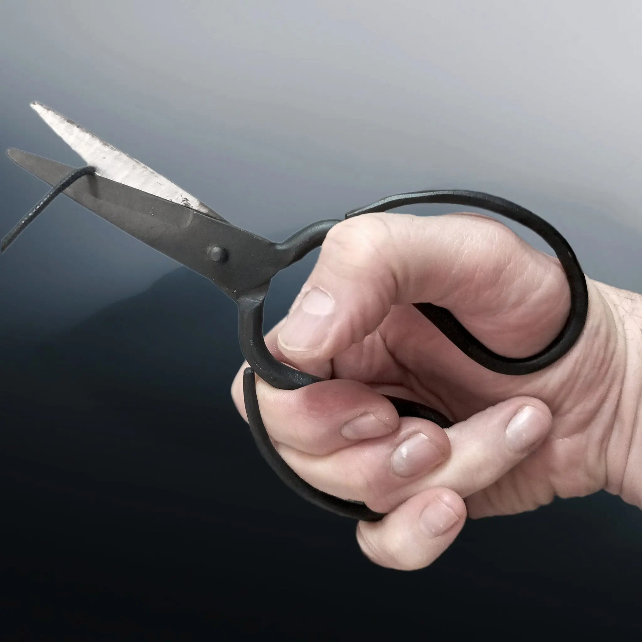 Hand-Forged Replica Medieval Iron Scissors in Hand Cutting Cord