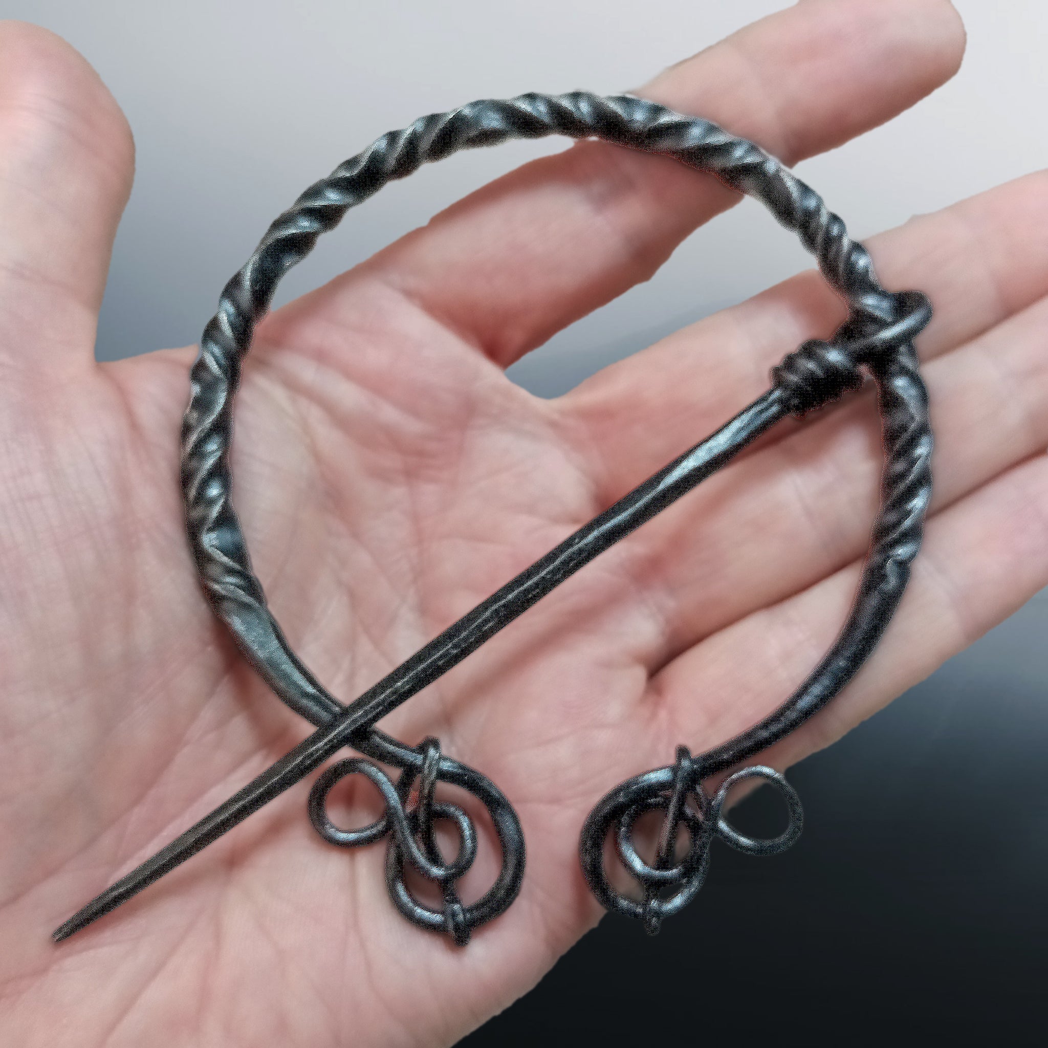Large Decorated Iron Viking Cloak Pin from Birka in Hand