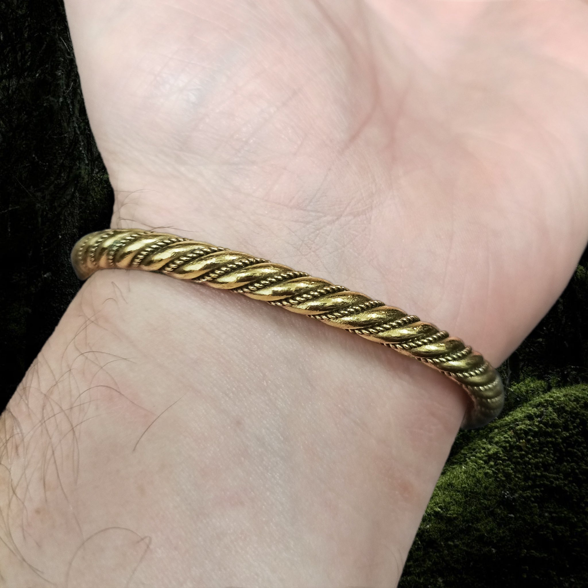 Handmade Twisted Bronze Bracelet With Gotlandic Dragon Heads on Wrist - Underside