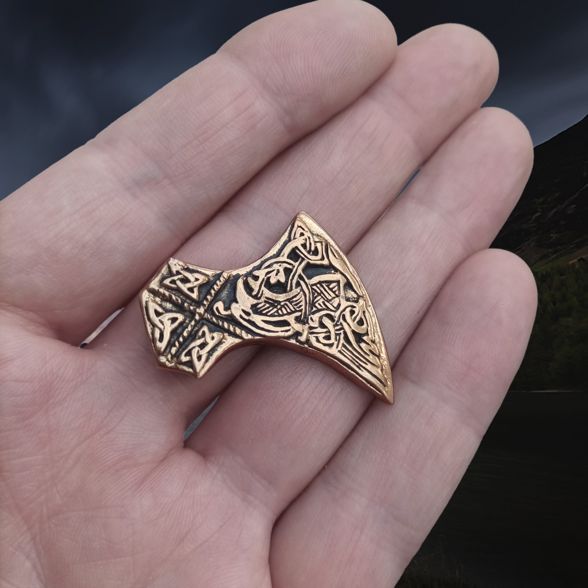 Bronze Knotwork Axe Head Pendant on Hand