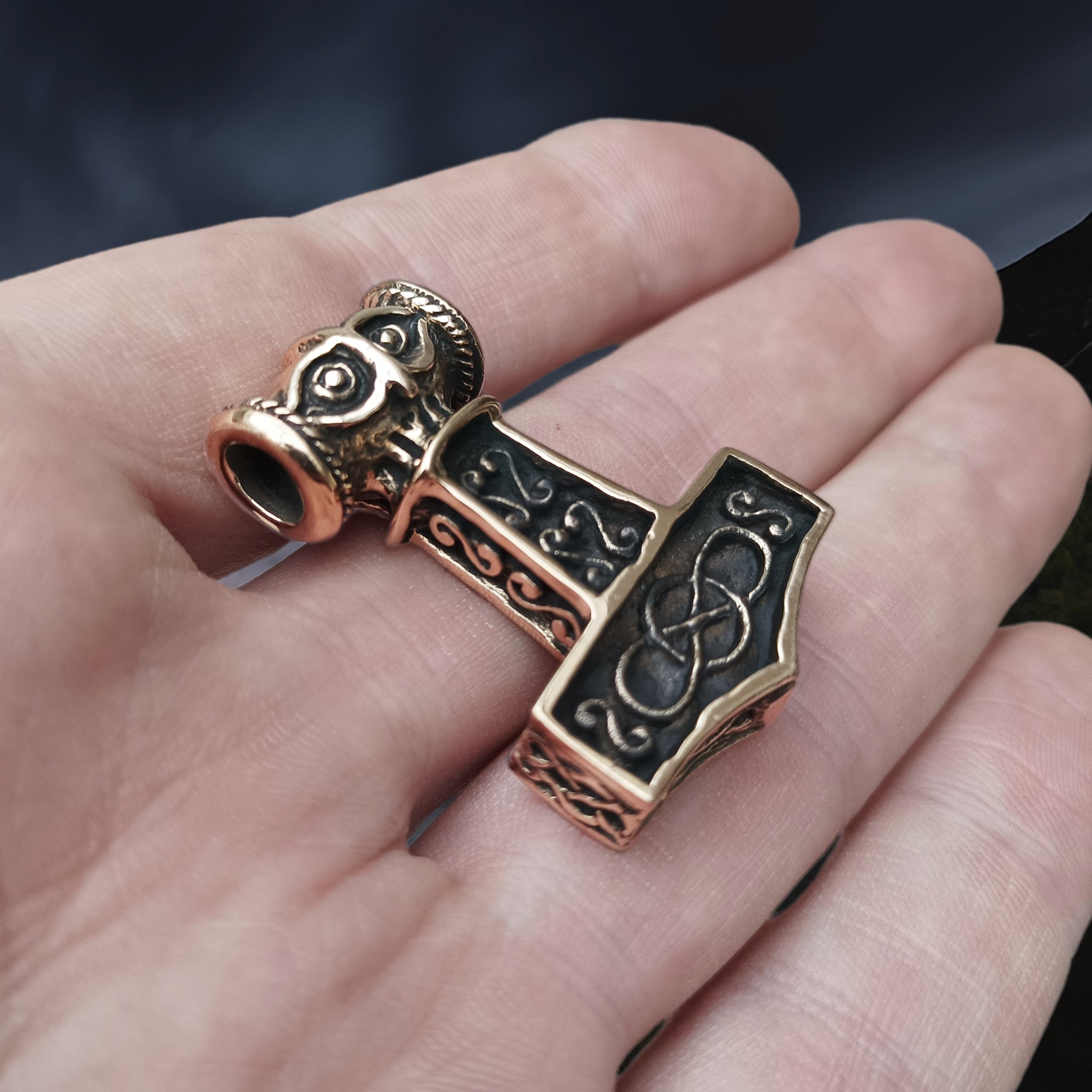 Medium Bronze Thors Thunder Hammer Pendant on Hand - Angle View