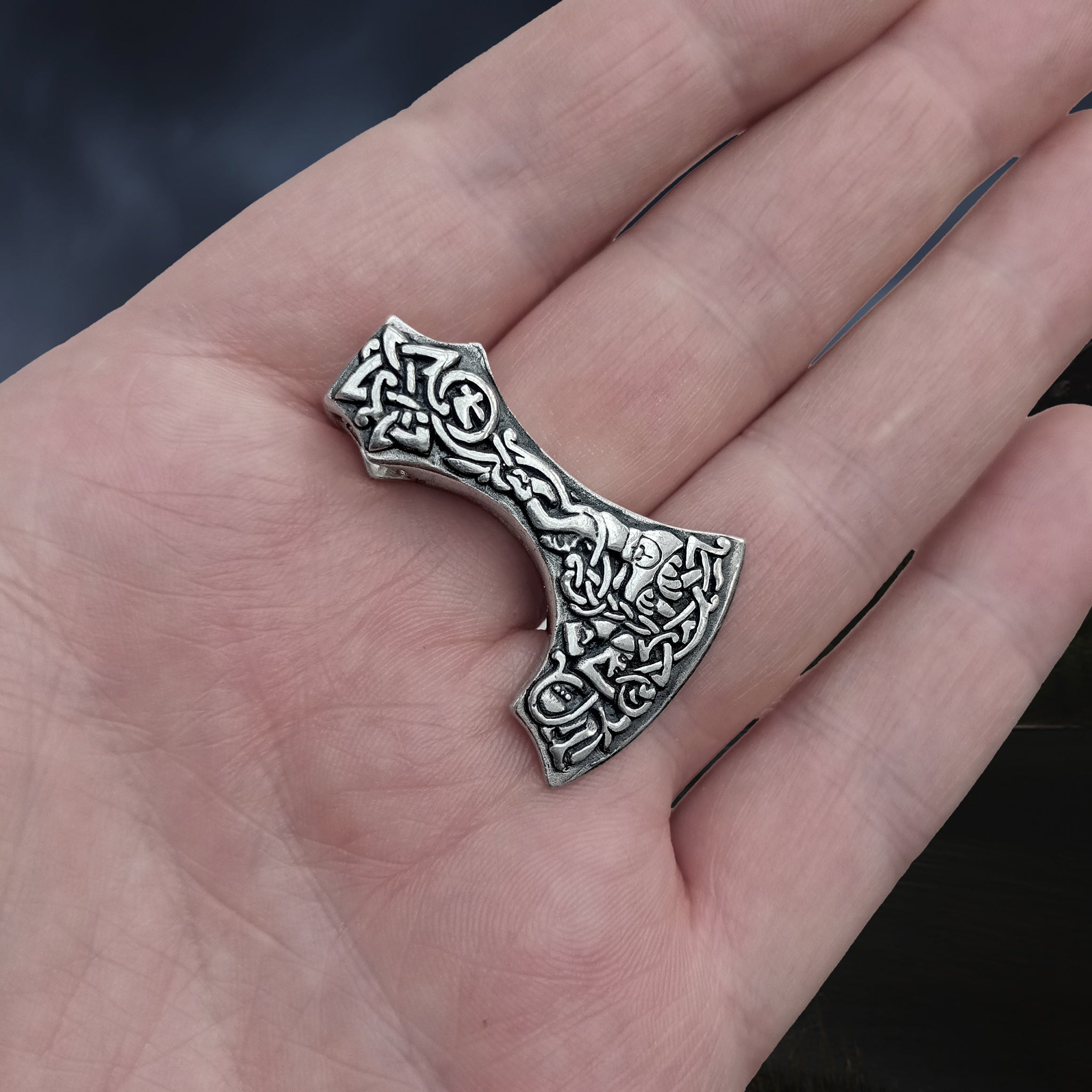 Silver Bearded Axe Head Viking Pendant on Hand - Slight Angle View