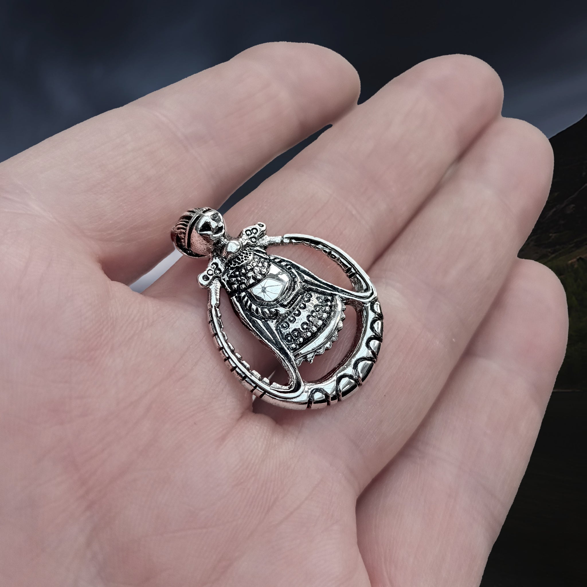 Silver Circular Freya Replica Viking Pendant on Hand - Side Angle View