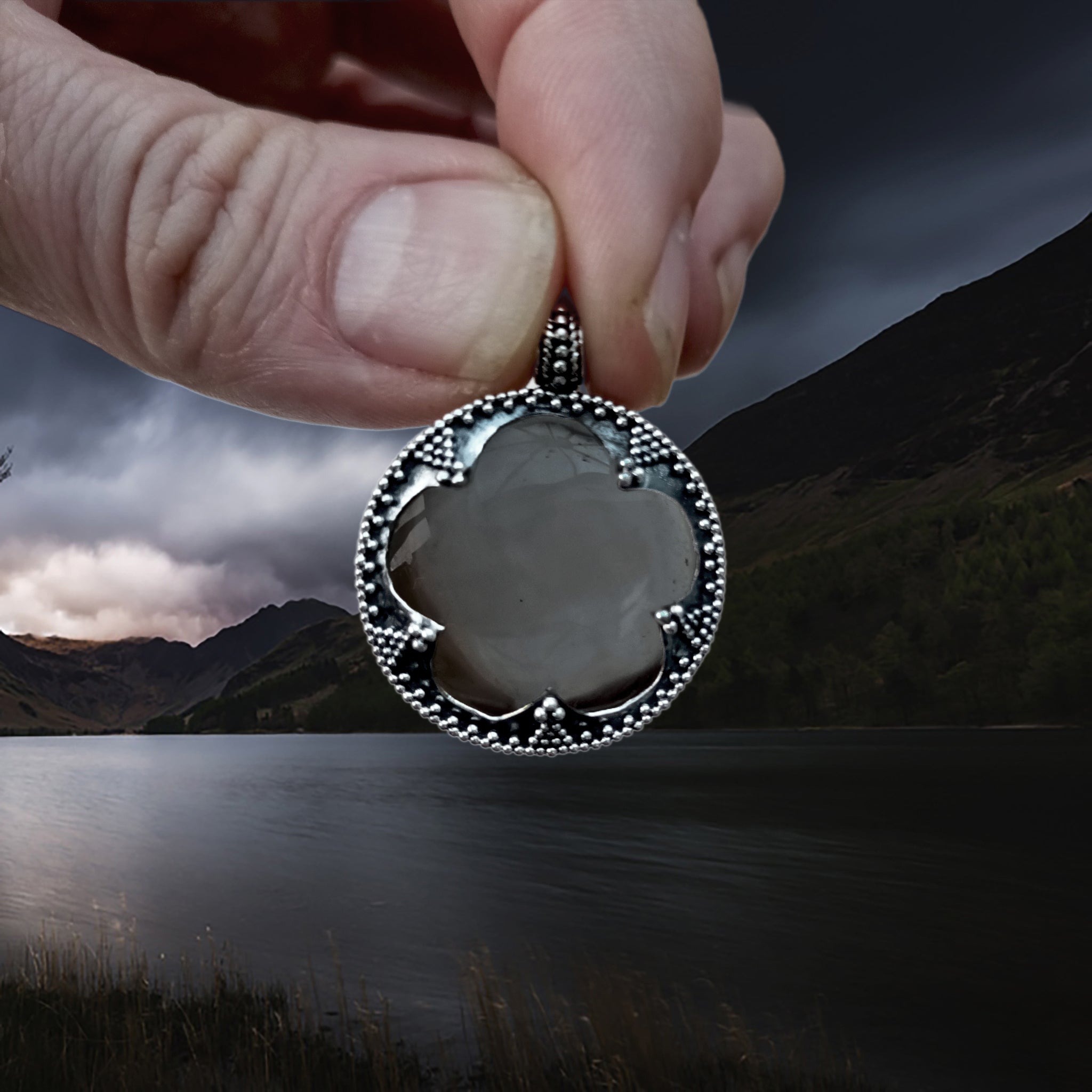 Large Silver Gotland Crystal Lens Pendant in Fingers