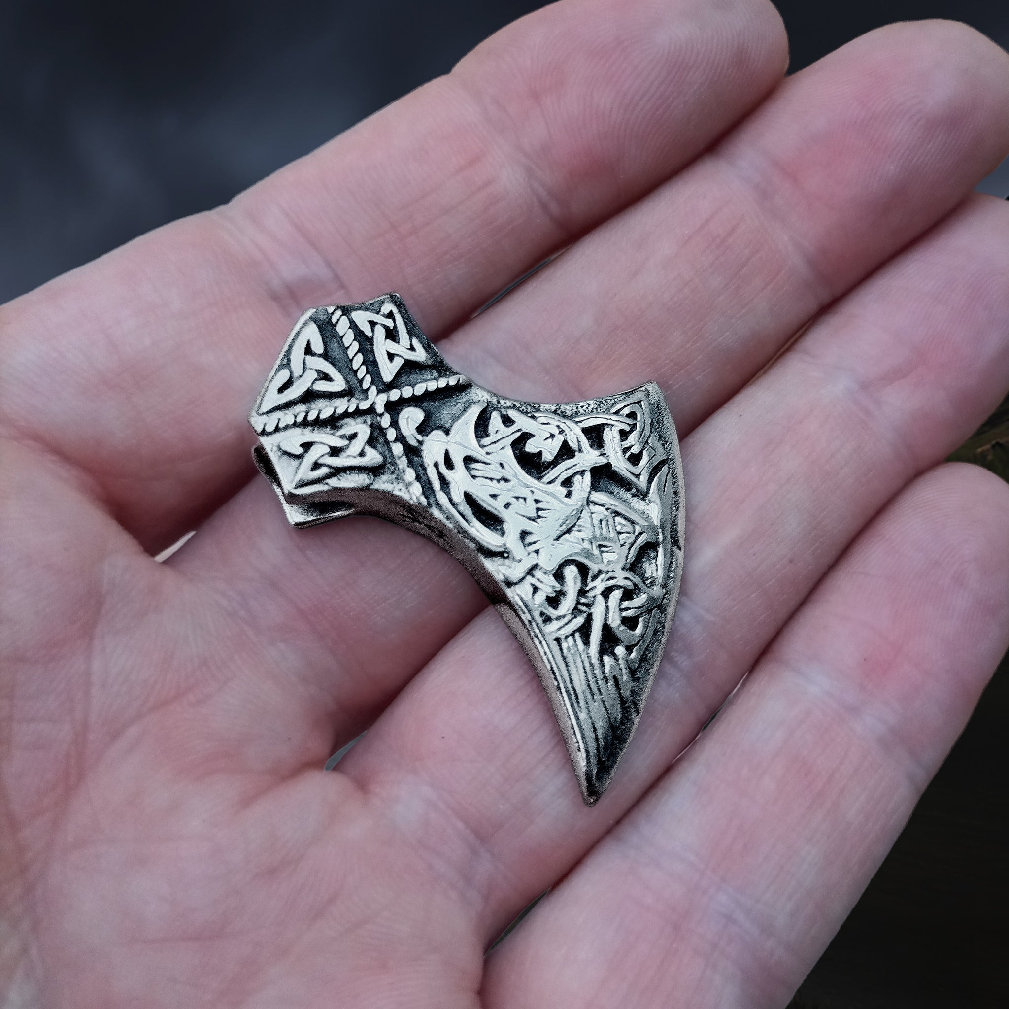 Silver Knotwork Viking Axe Head Pendant on Hand - Angle View