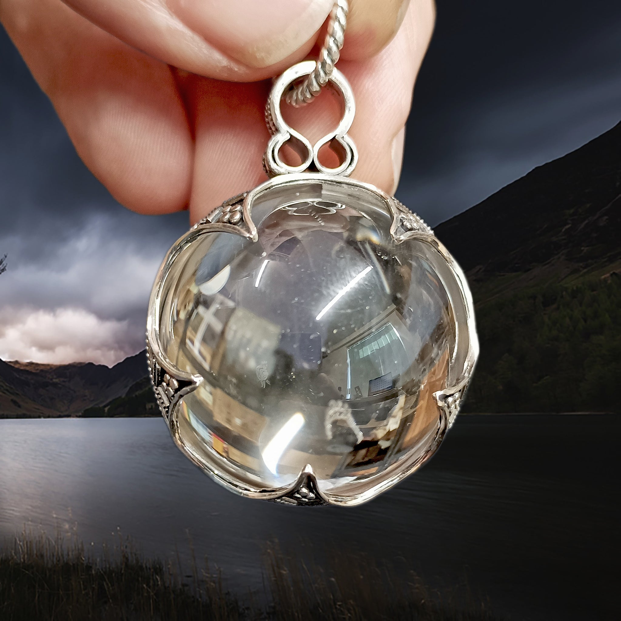 Large Silver Gotland Crystal Ball Pendant in Fingers - Front View