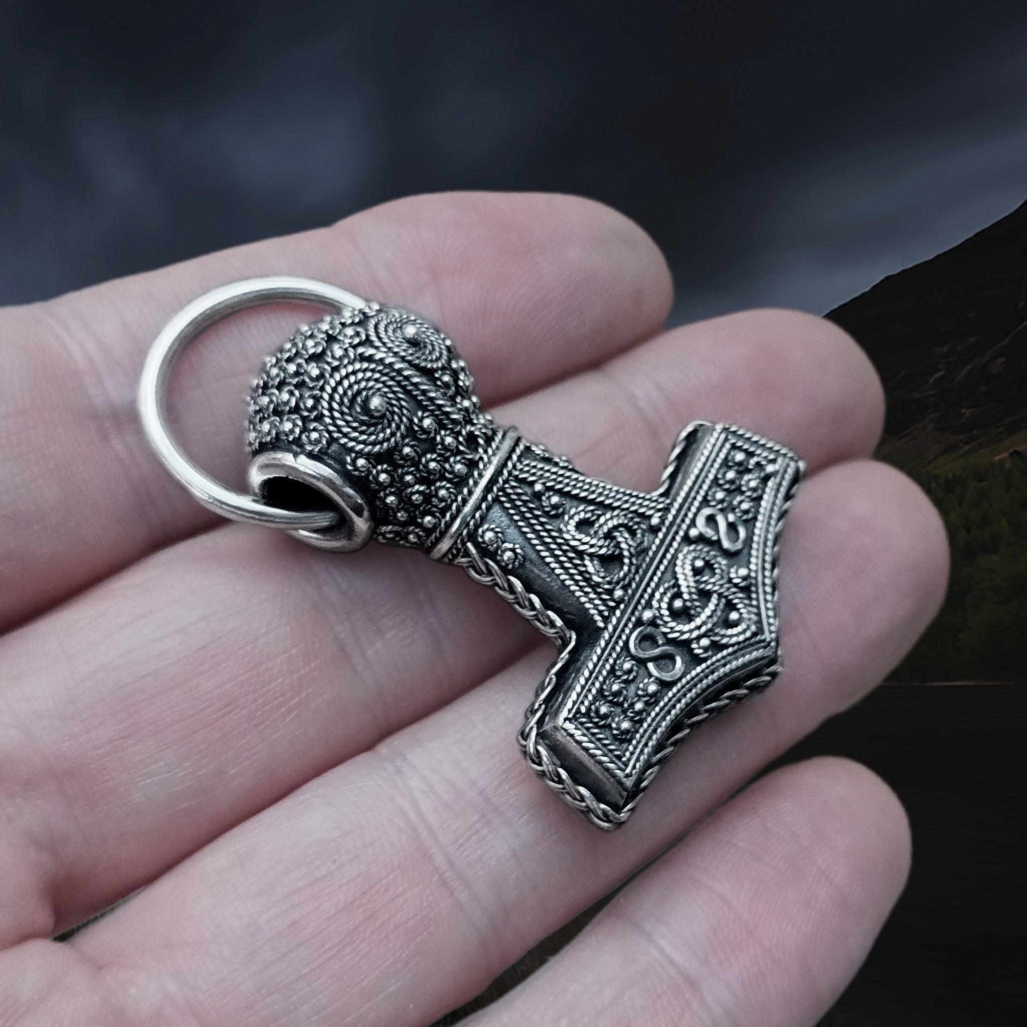 Silver Filigree Thors Hammer Pendant Replica from Öland with Split Ring on Hand - Angle View