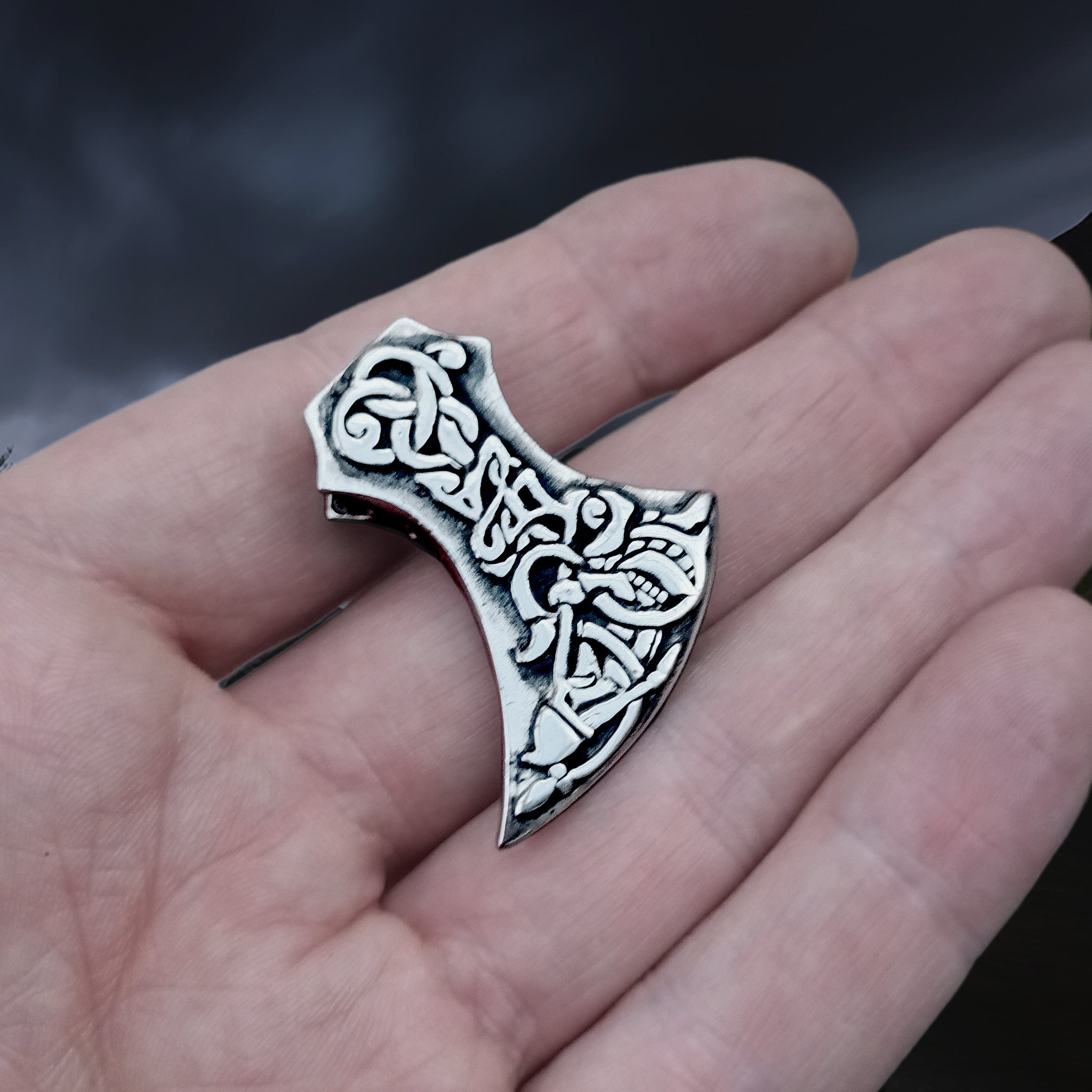 Silver Tyr and Fenrir Viking Axe Head Pendant on Hand - Anlge View