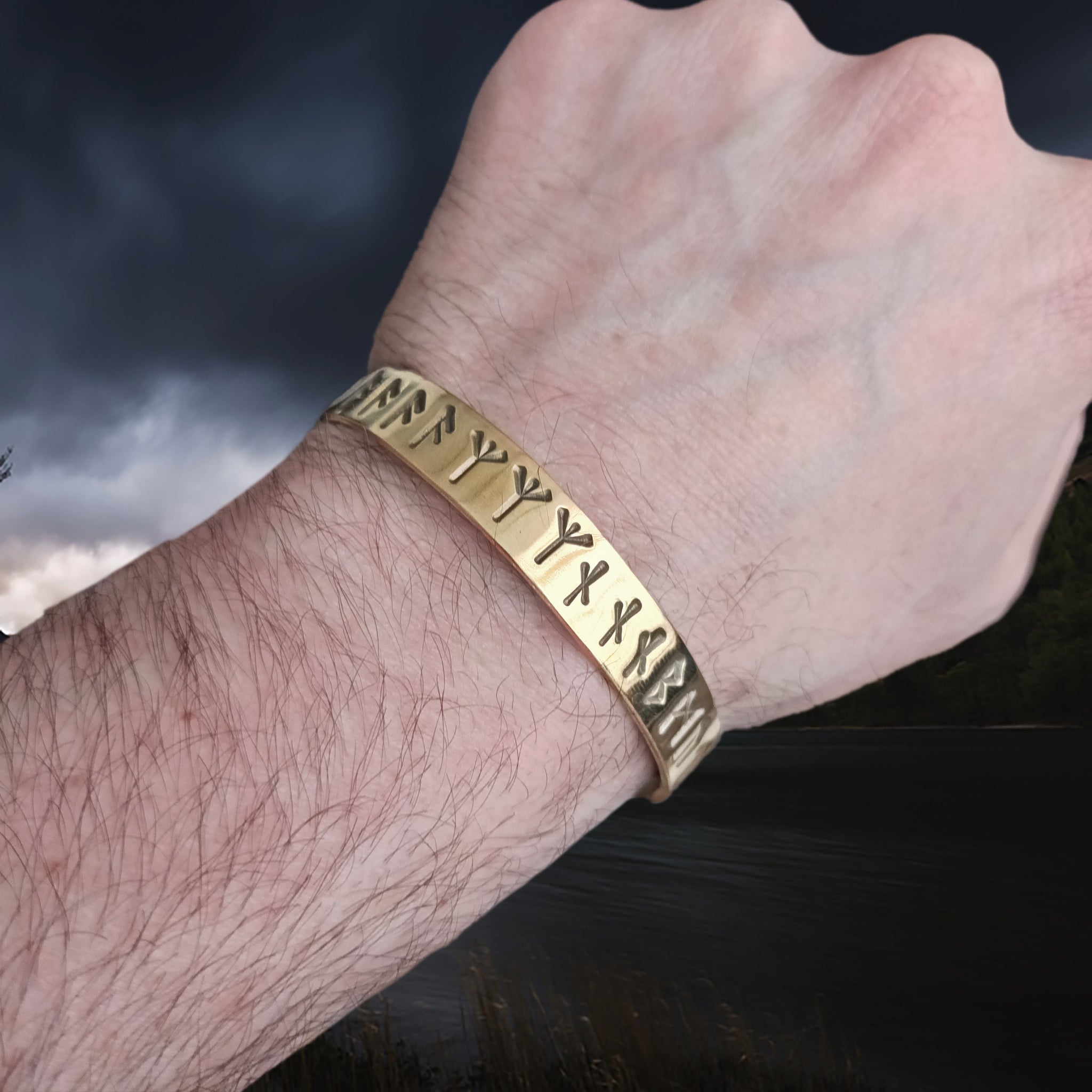 Runic Dark Age Bracelet in Solid Brass with Runic Inscription from Lindholm on Wrist - Angle View