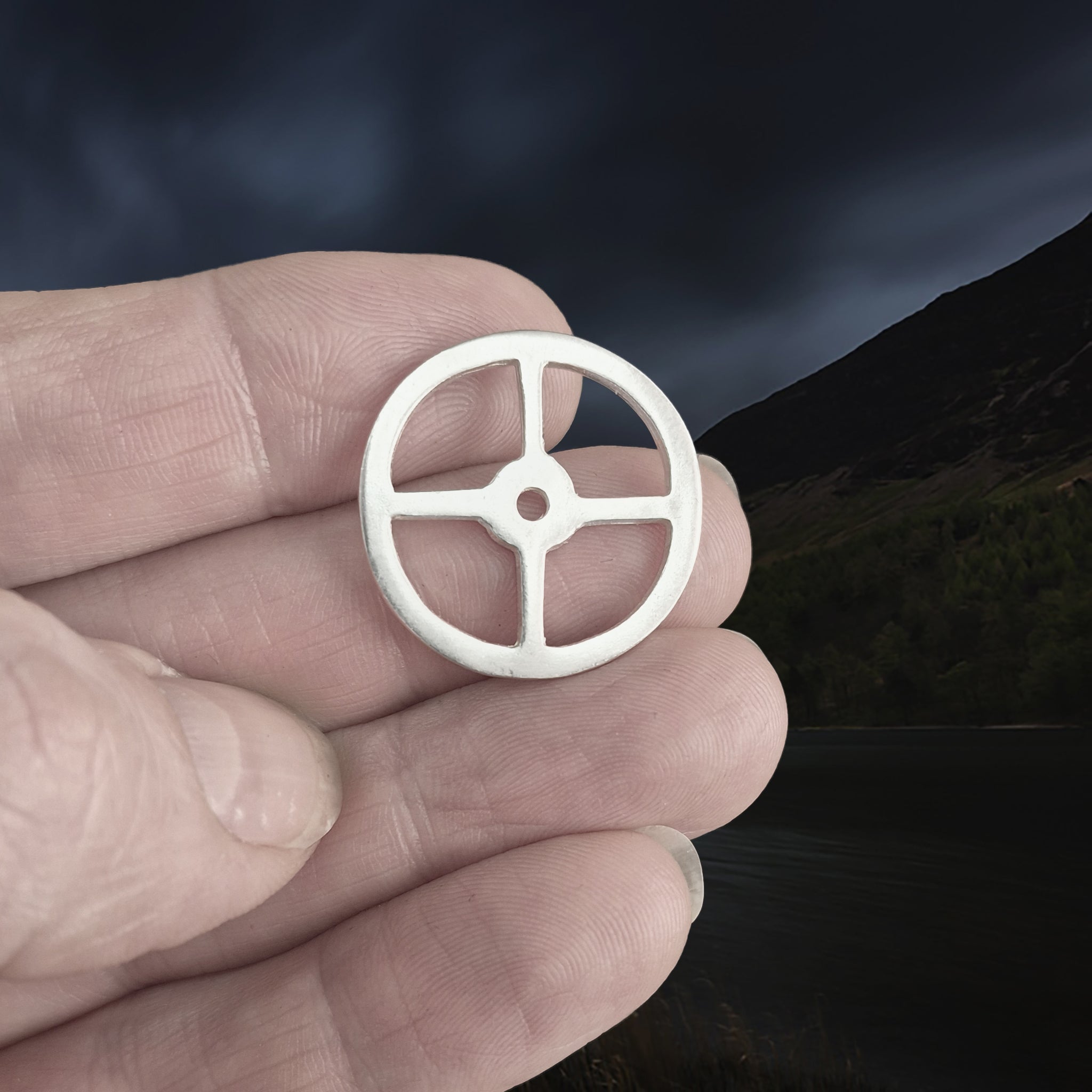 Handmade Replica Viking Sun Cross Odin Pendant in Sterling Silver on Fingertips