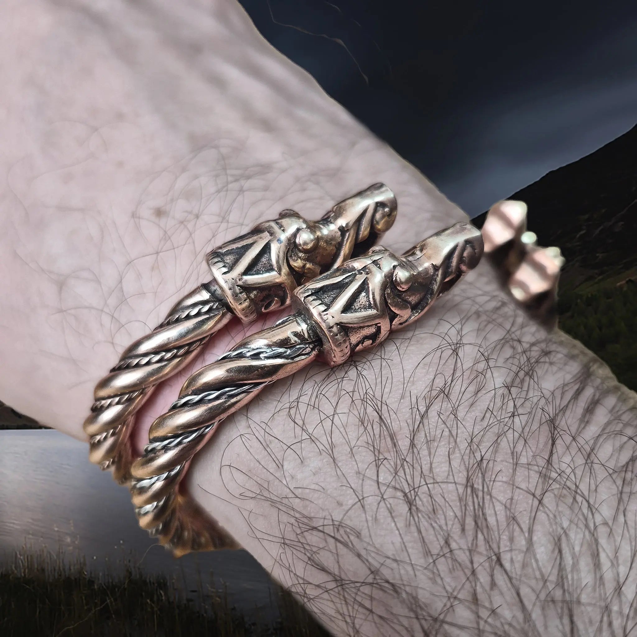 Handmade Twisted Bronze Bracelet With Gotlandic Dragon Heads with Bronze & Silver Version on Wrist - Side Angle View