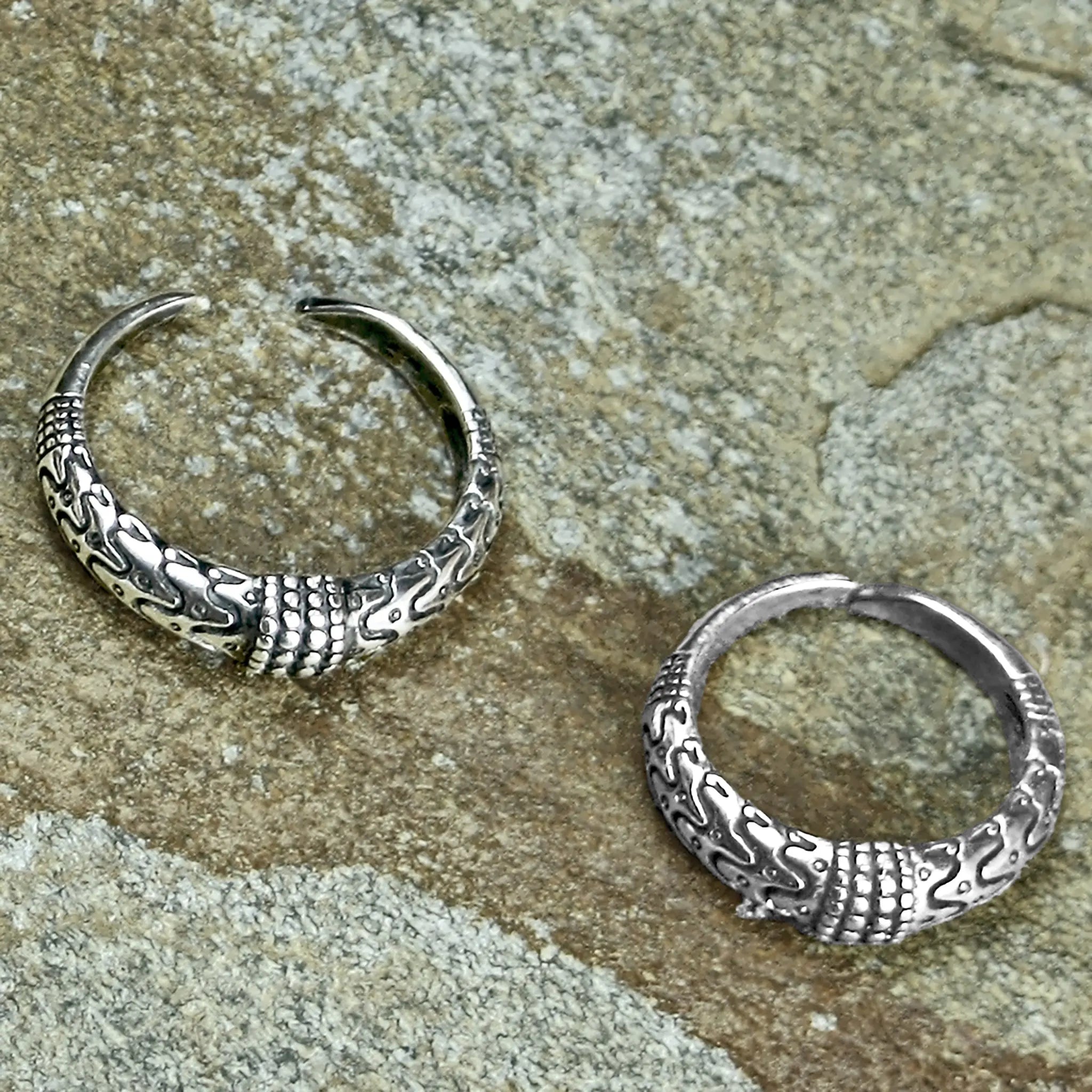 Replica Viking Rings from Orupgård, Falster in Denmark in Sterling Silver on Rock - Above Angle View