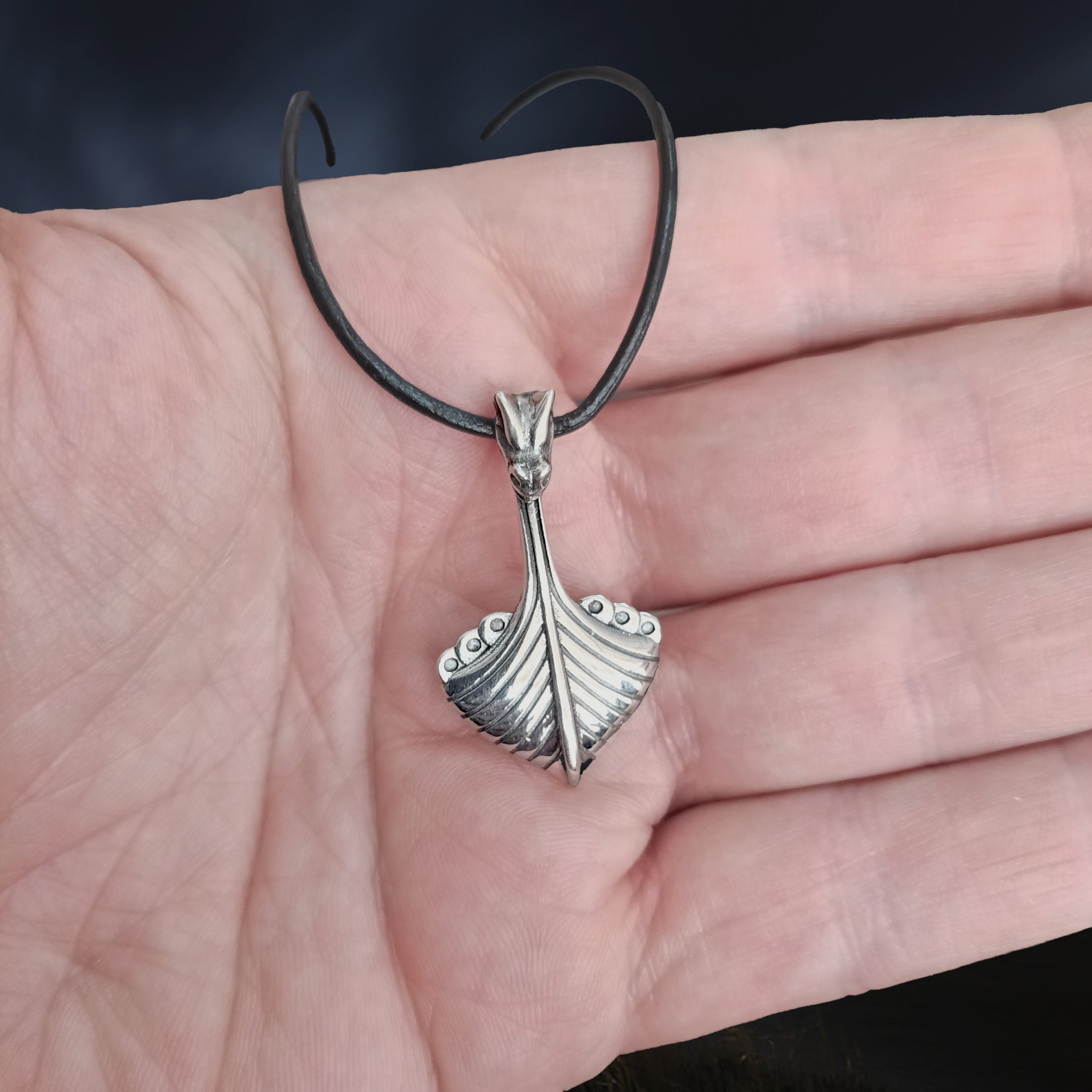 Replica Norwegian Viking Ship Pendant in Sterling Silver on Leather Cord on Hand