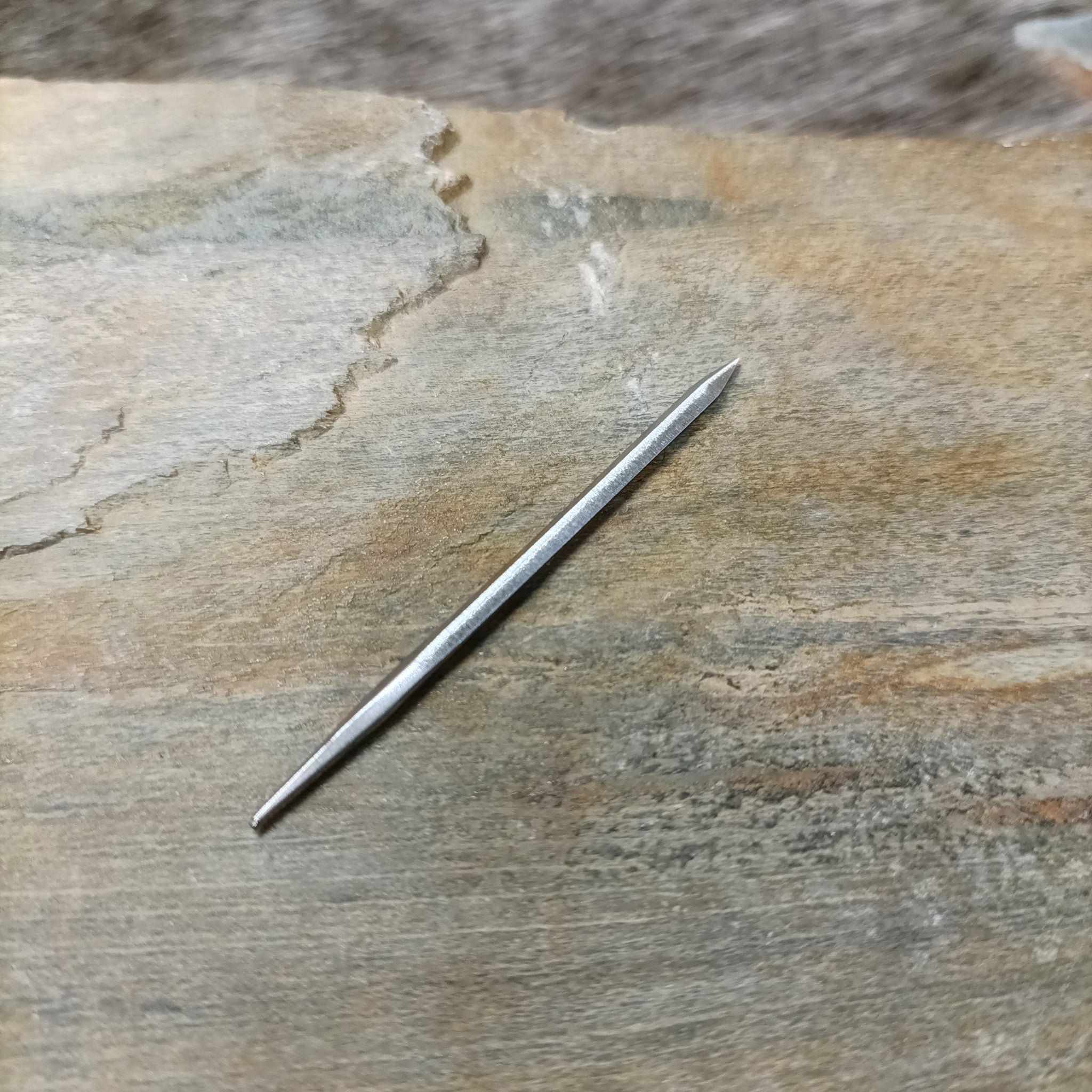 Diamond Cut Awl Blade on Rock