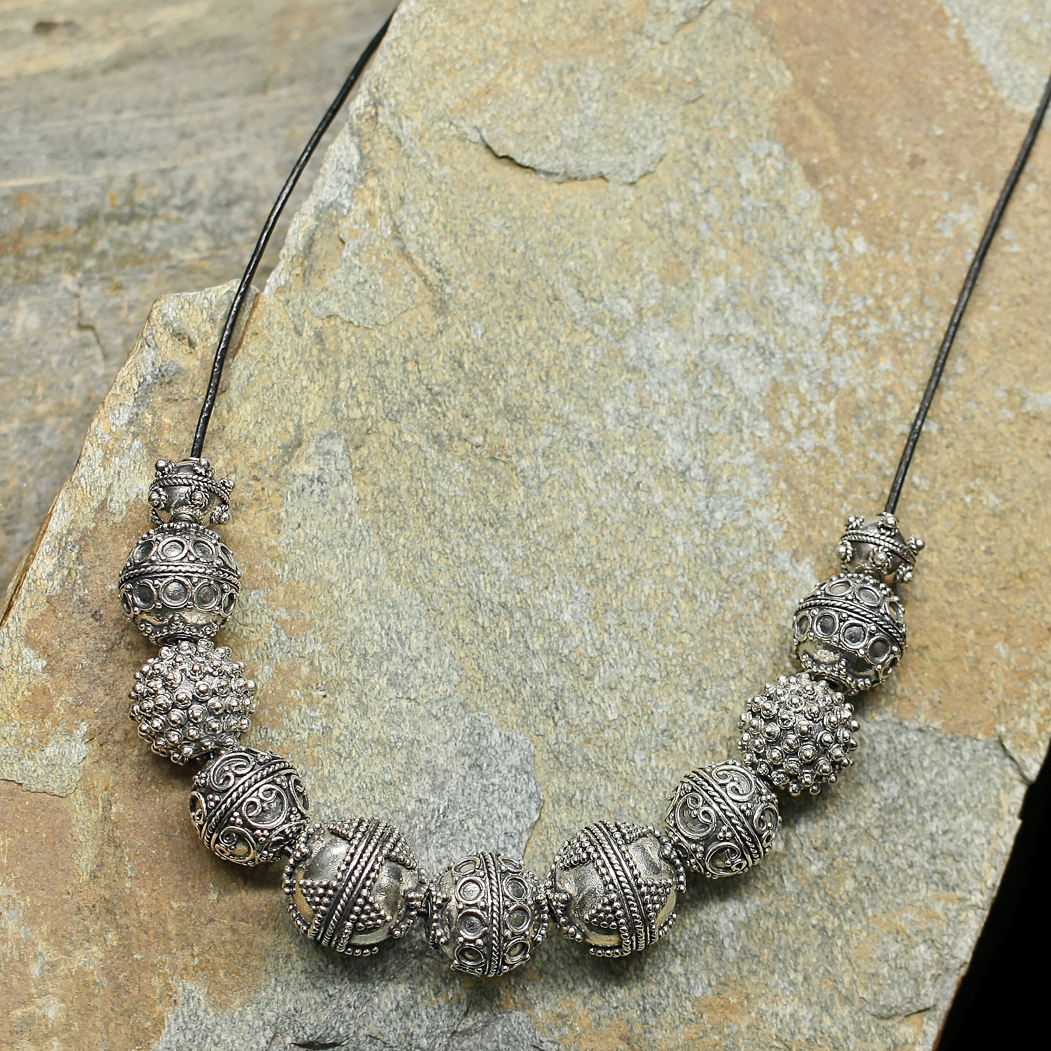 Silver Viking Beads from Visby on Leather Thong on Rock