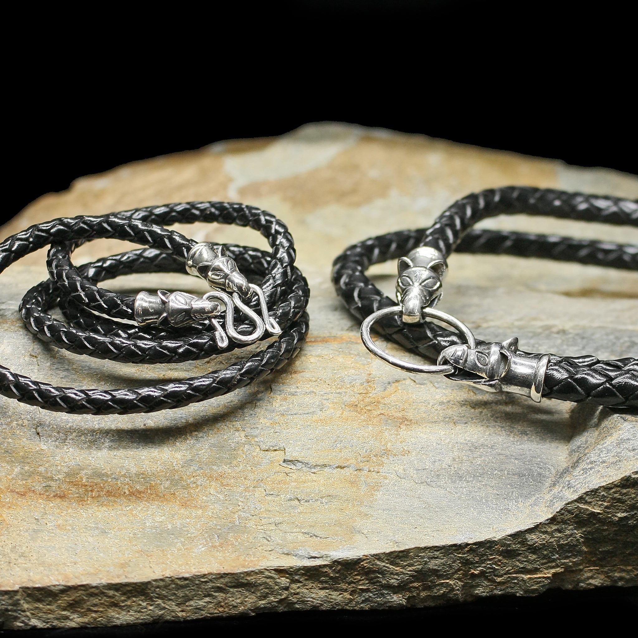 Braided Leather Necklace with Silver Icelandic Wolf Heads on Rock
