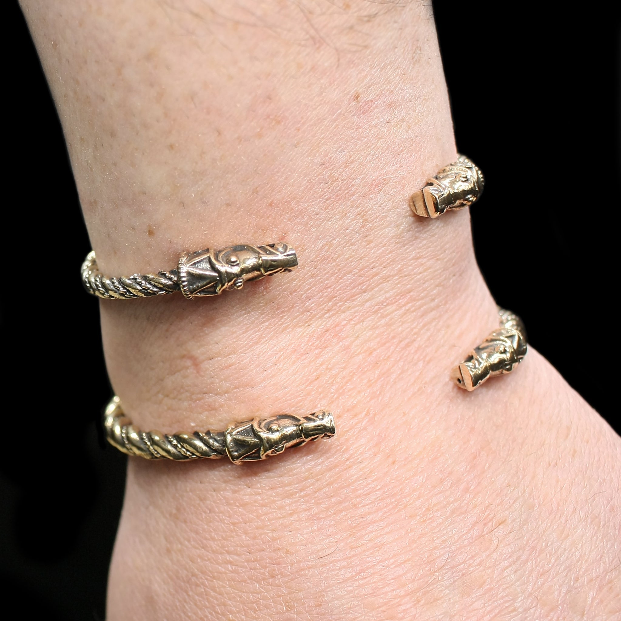Twisted Bronze Bracelets With Gotlandic Dragon Heads on Wrist