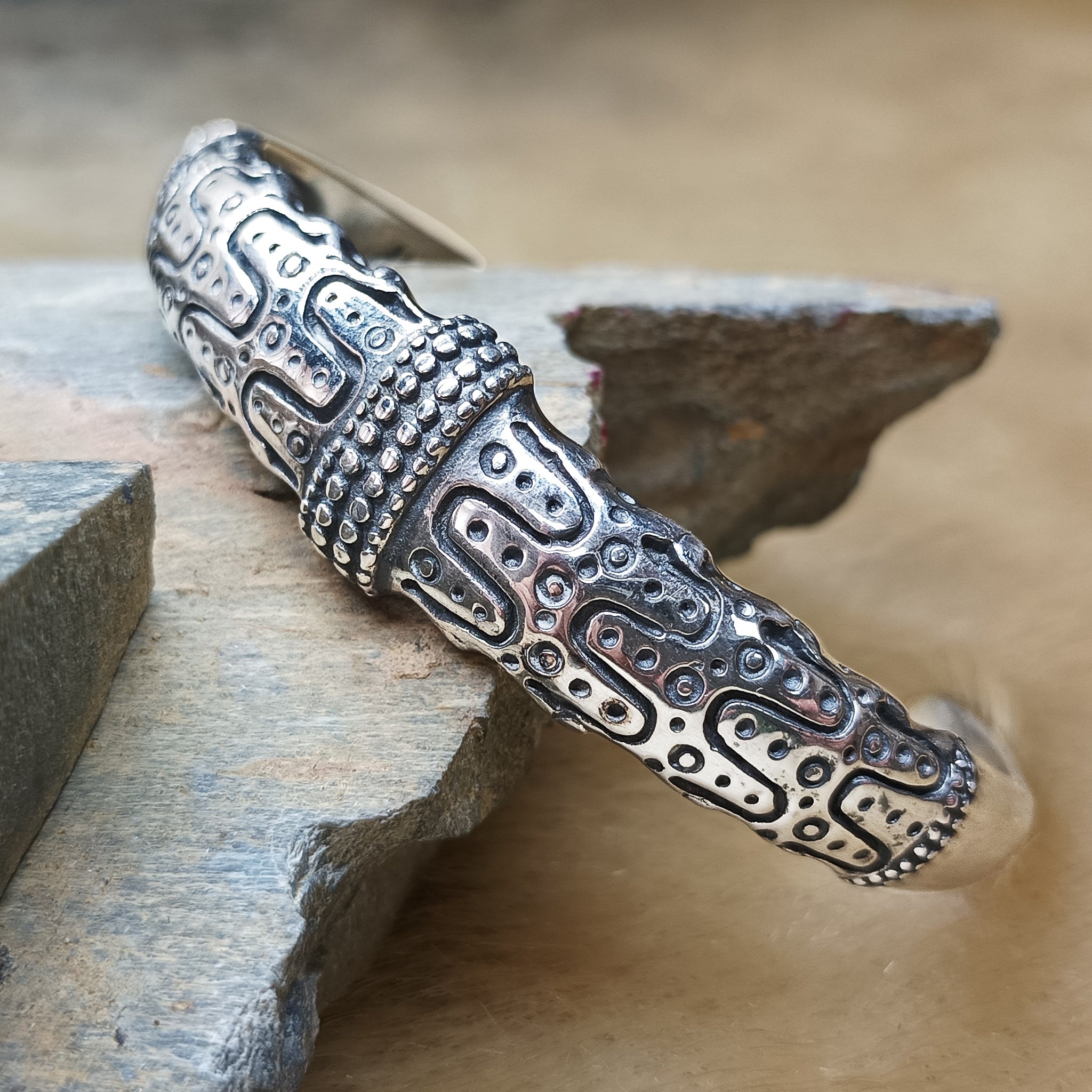 Silver Viking Bracelet from Falster on Rock - Angled View