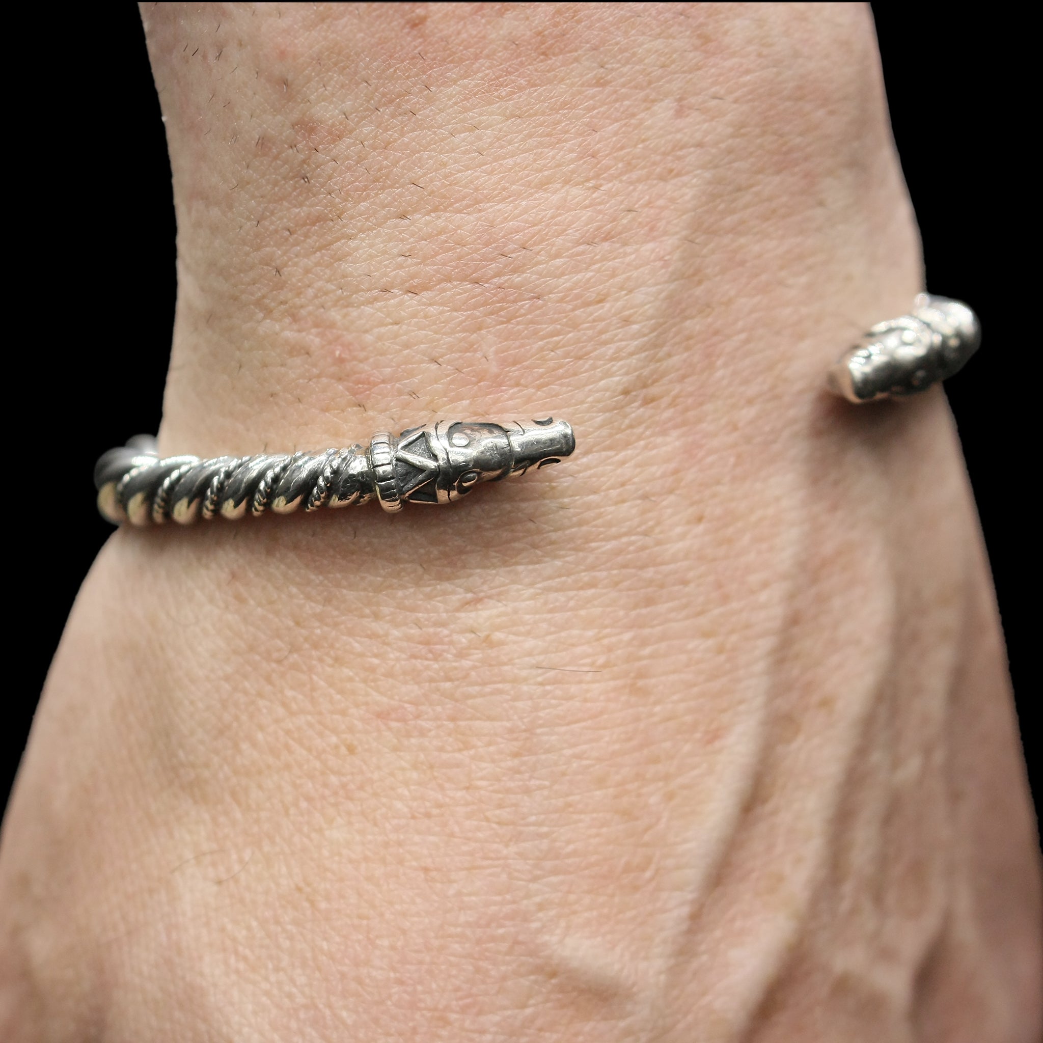 Medium Twisted Silver Bracelet With Gotlandic Dragon Heads On Wrist