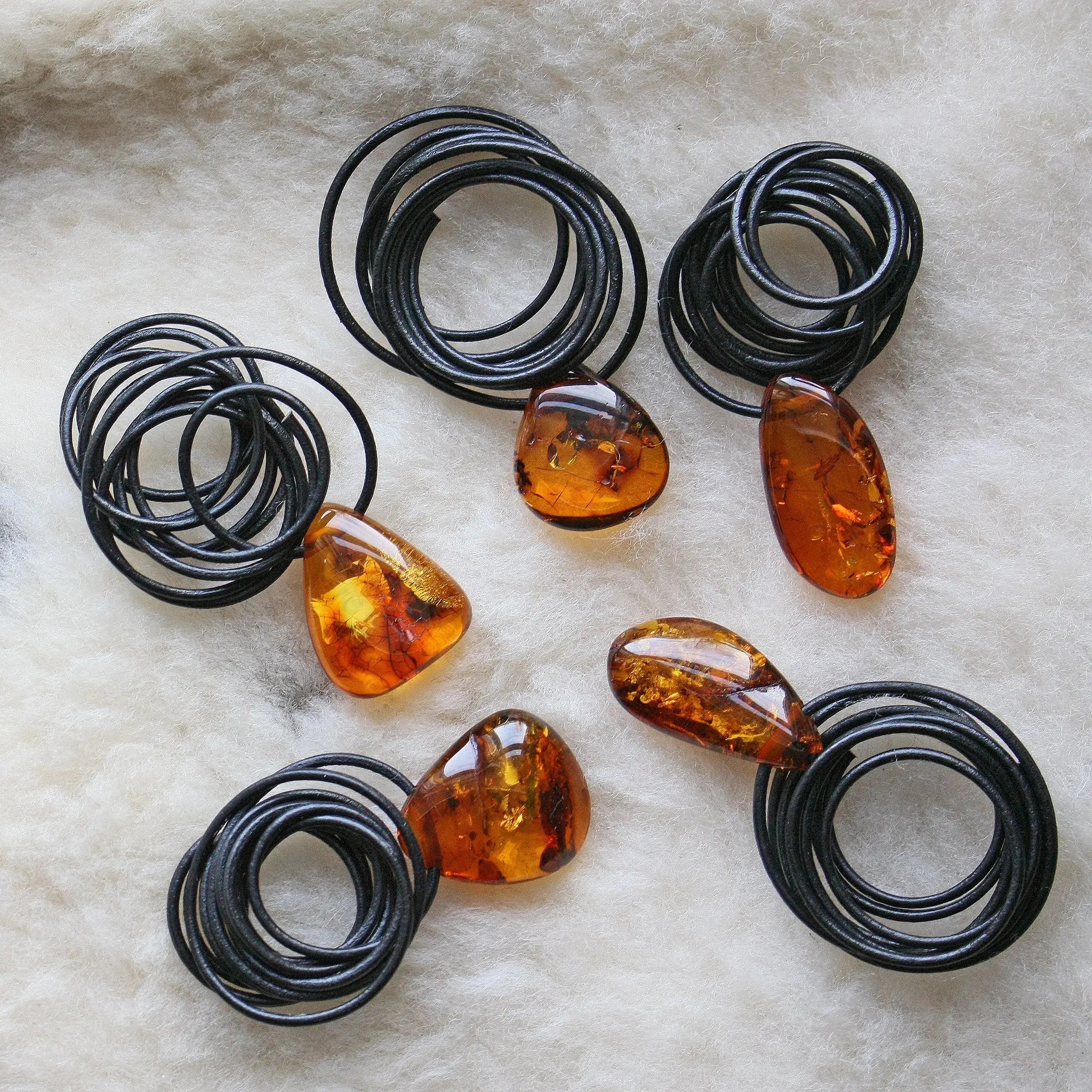 Large Amber Amulet Pendants on Sheep Fleece