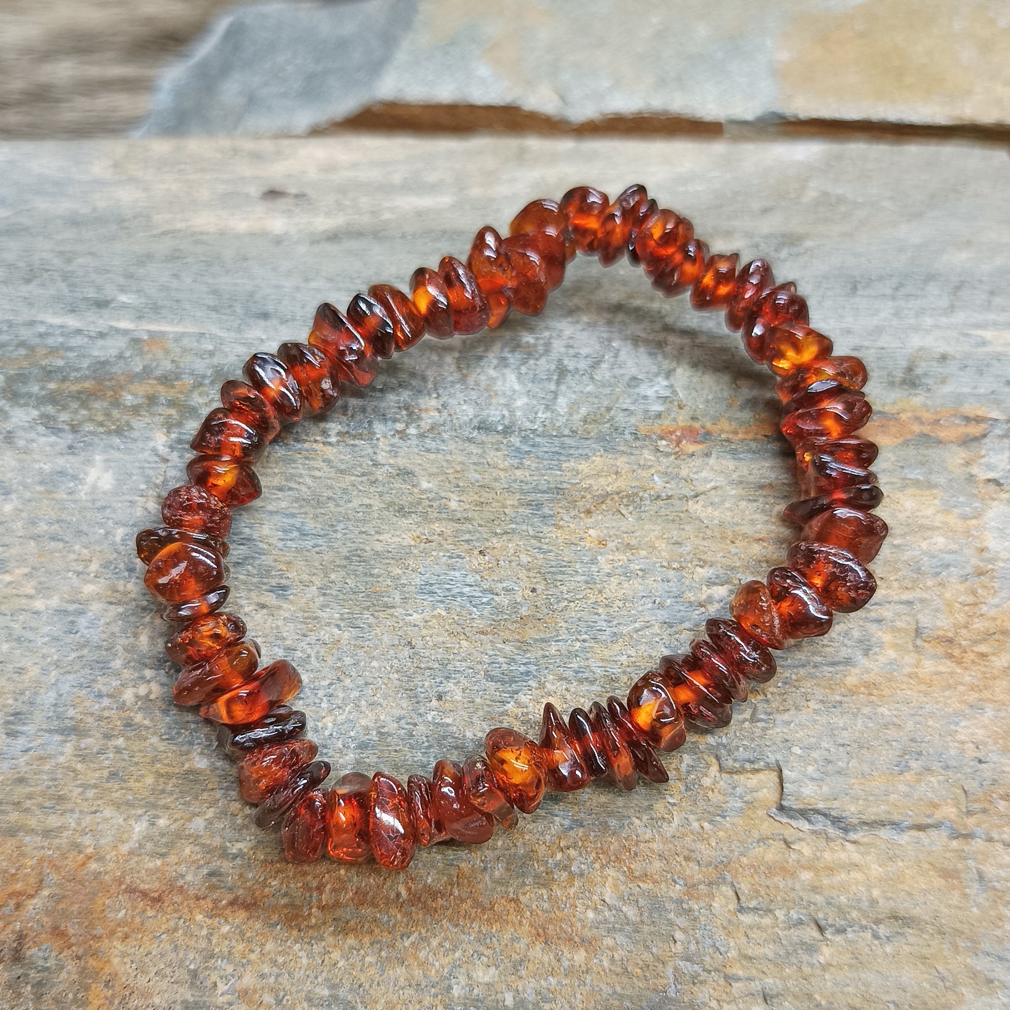 Polished Amber Chip Bracelet on Rock