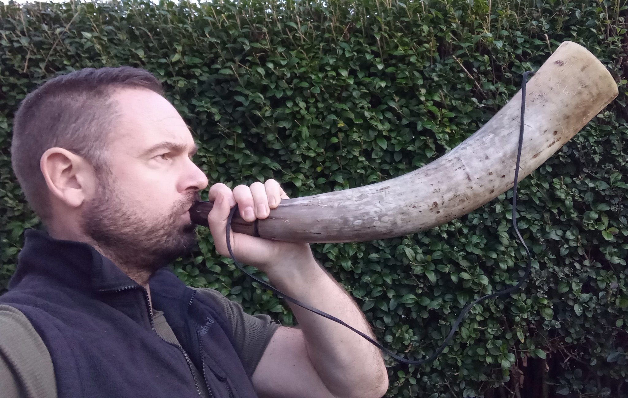 Blowing a Large Viking Blowing Horn / Bugle Outside
