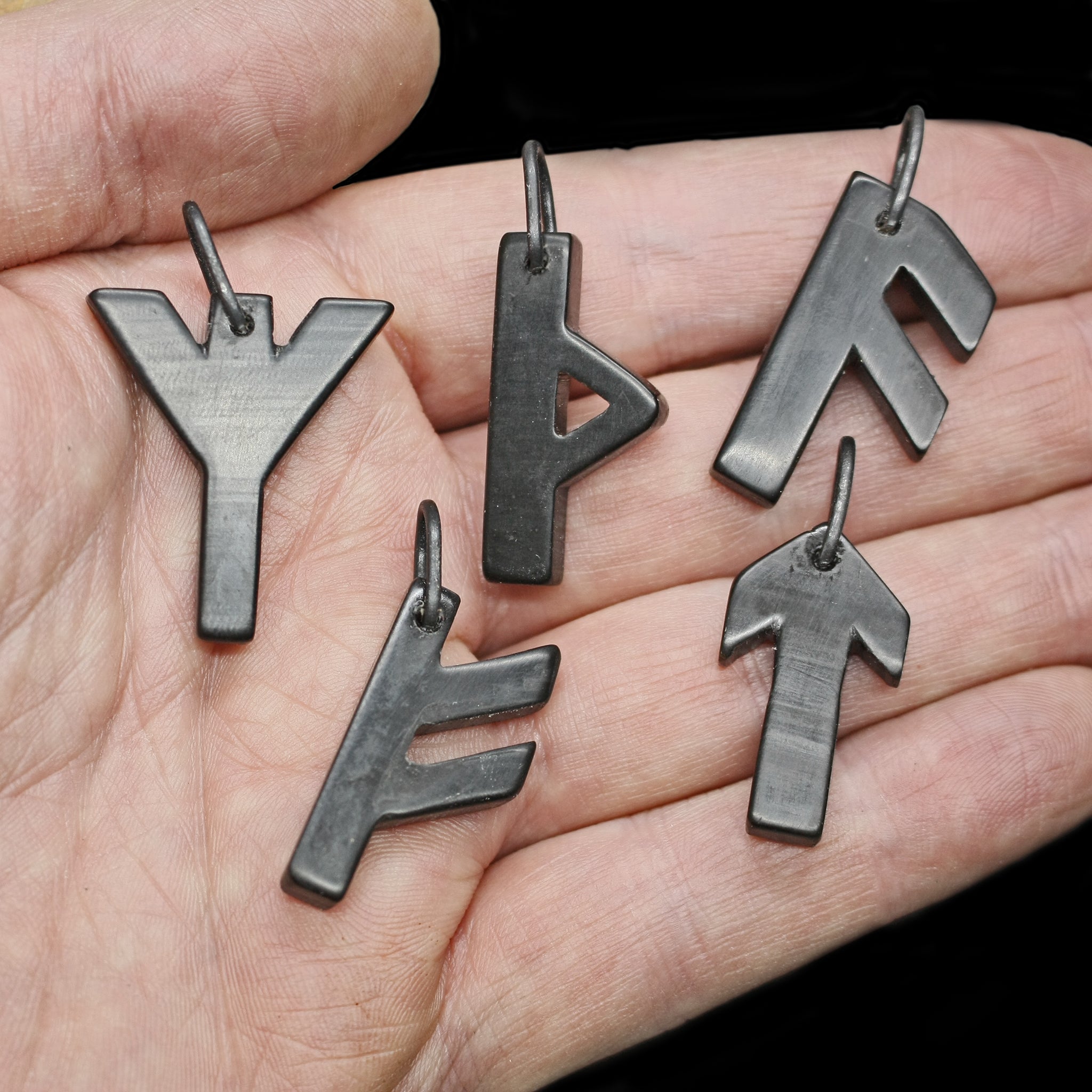 Black Horn Futhark Rune Pendants on Hand