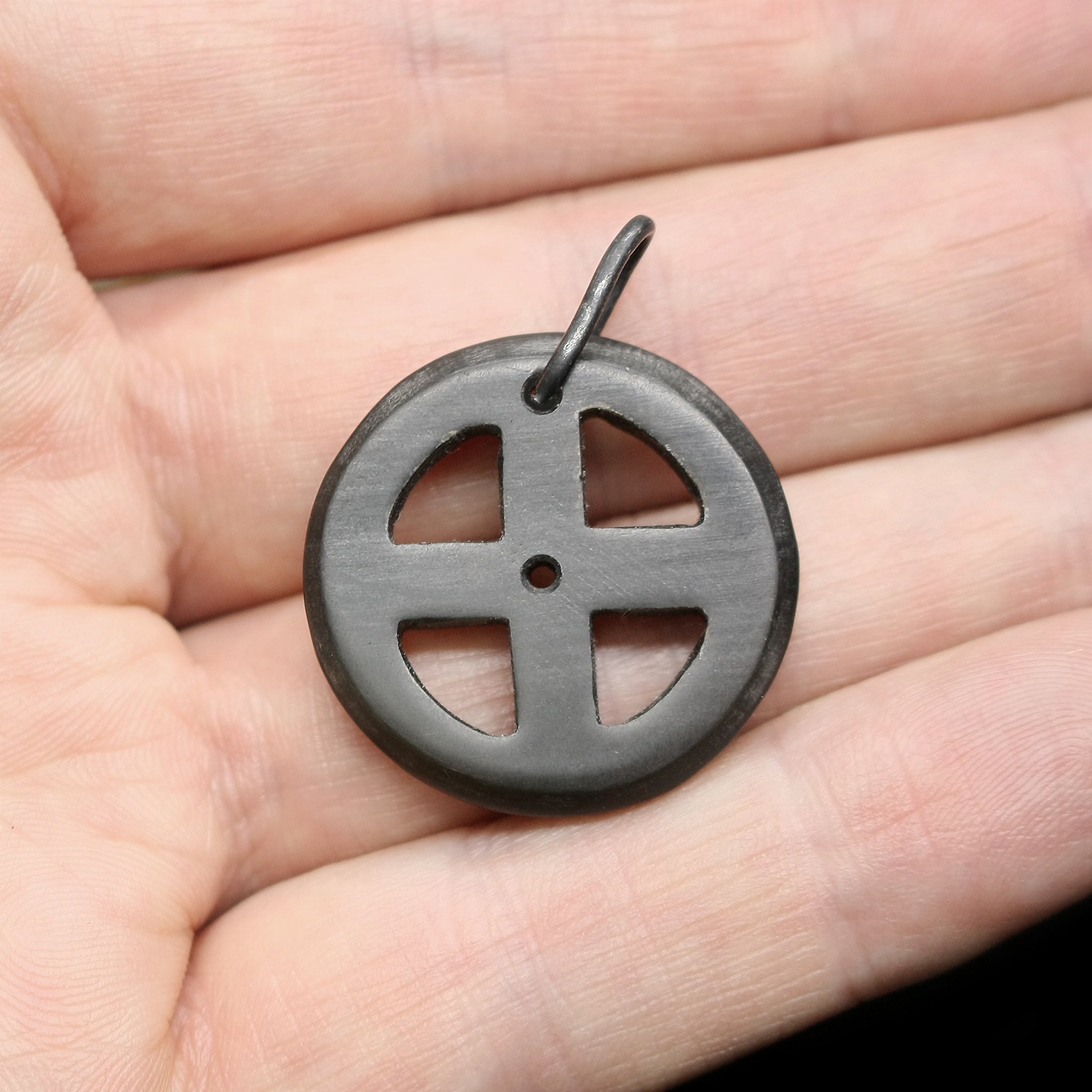 Black Horn Sun Cross Odin Pendant on Hand