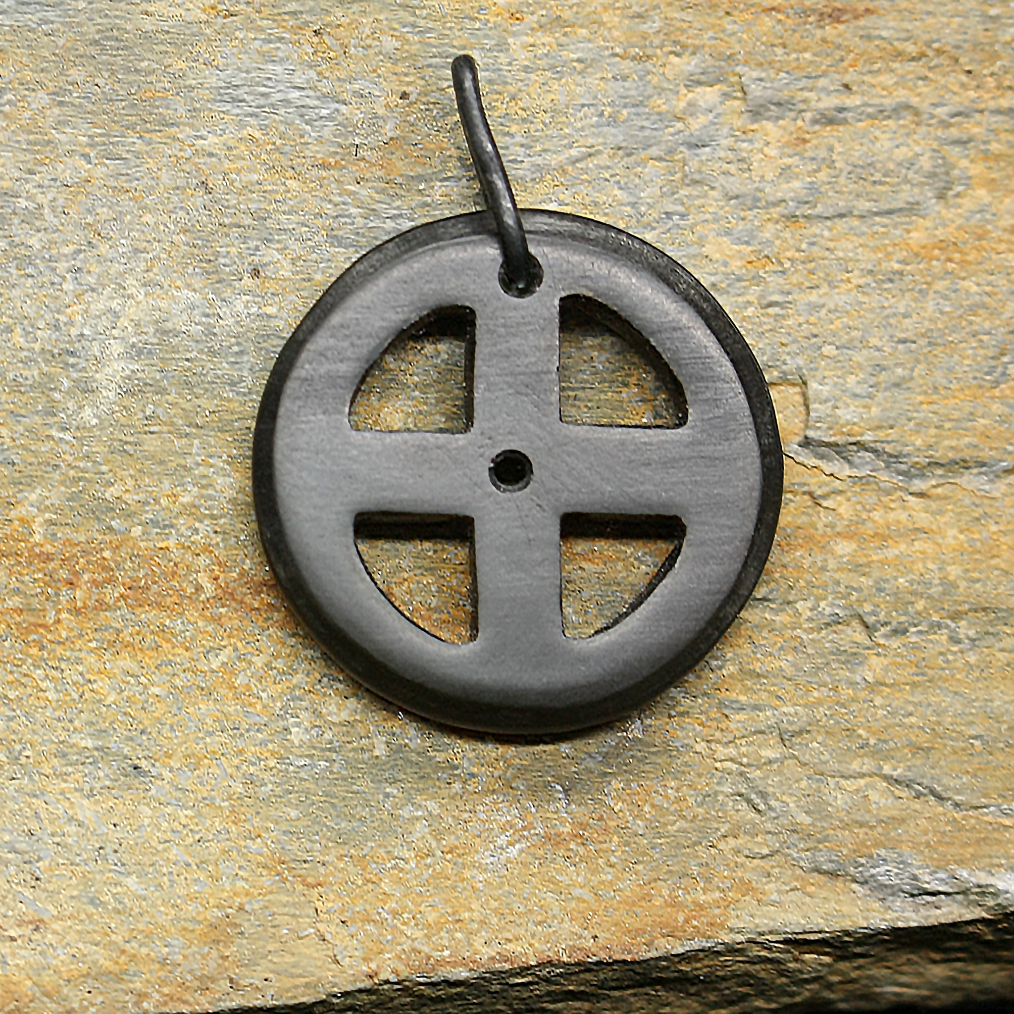 Black Horn Sun Cross Odin Pendant on Rock