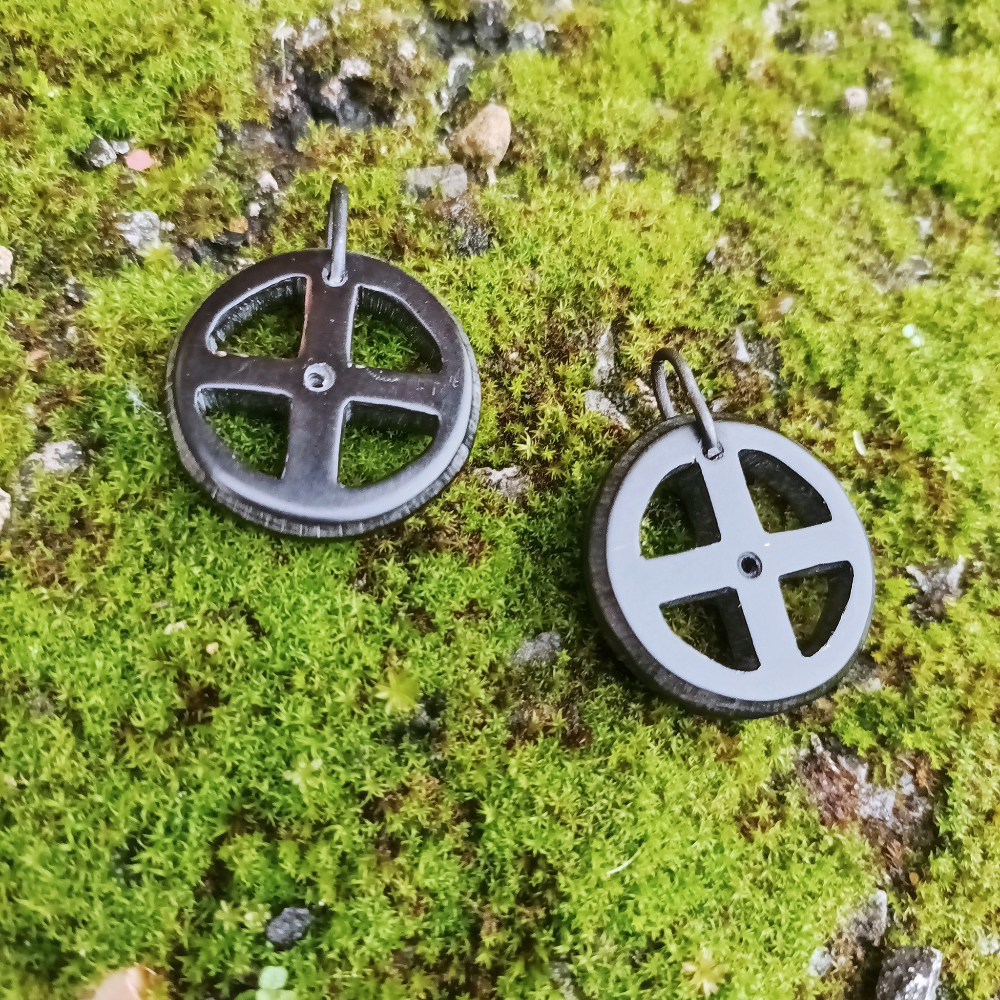 Black Horn Sun Cross Odin Pendants on Moss