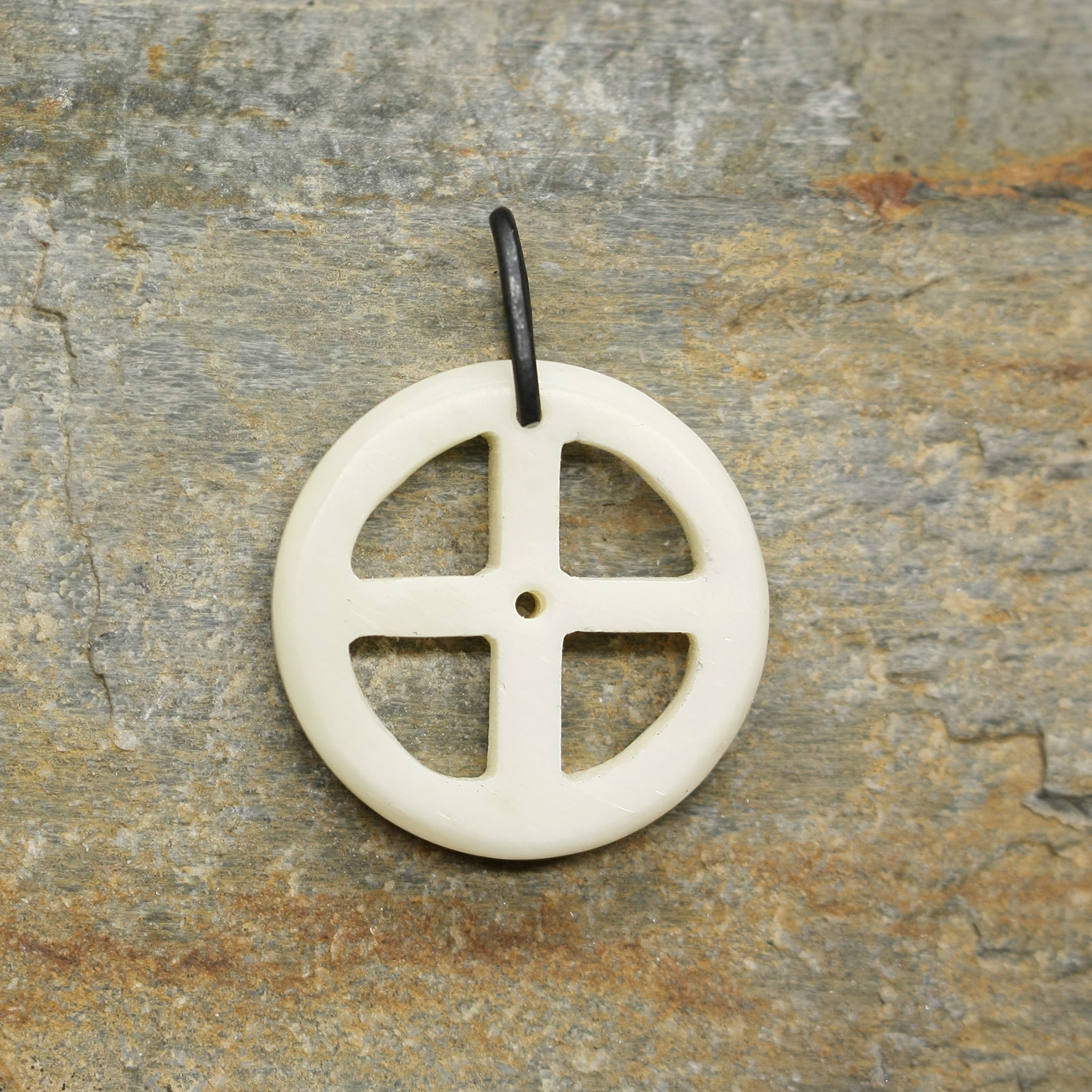 Bone Sun Cross Odin Pendant on Rock