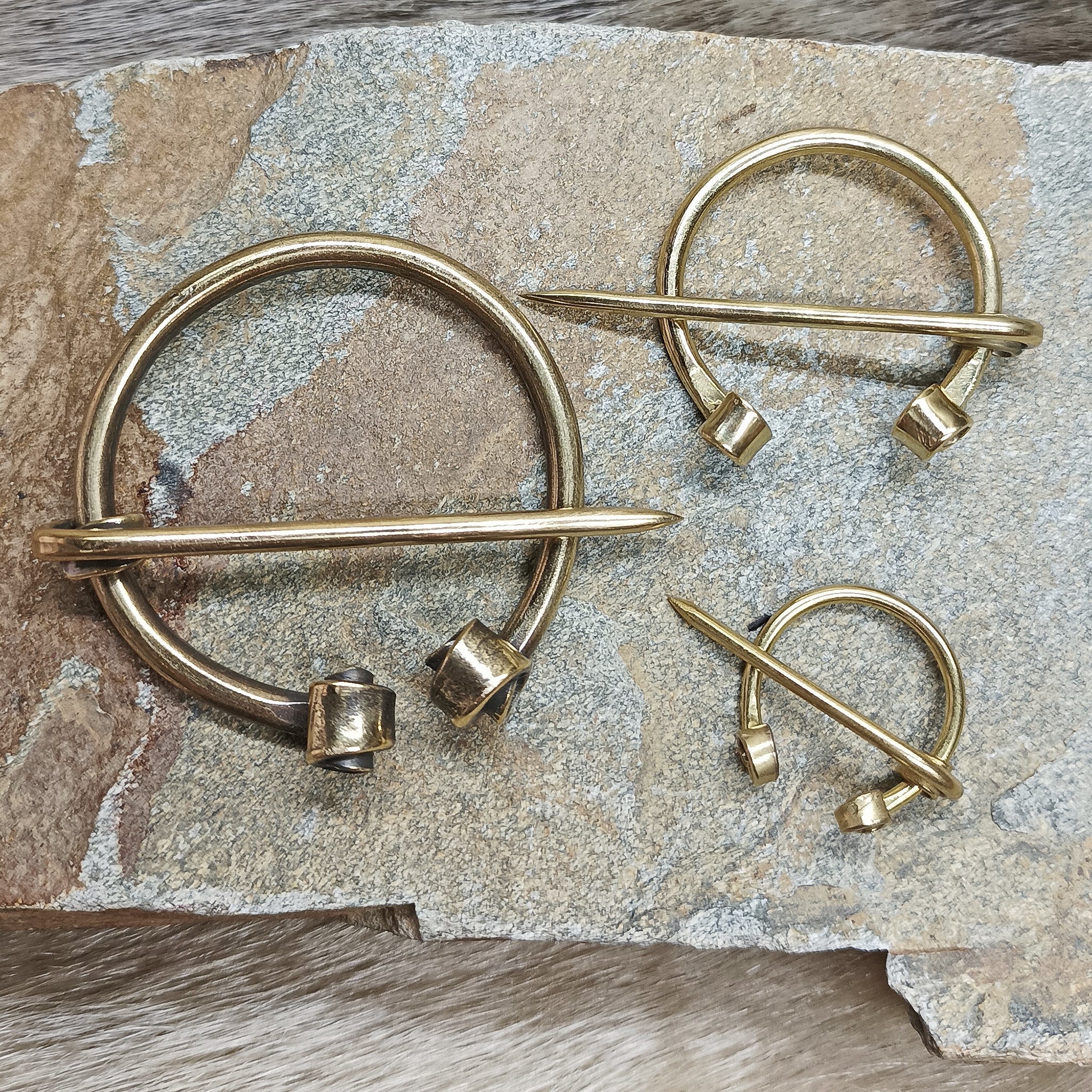 Brass Cloak Pins / Clothes Pins on Rock
