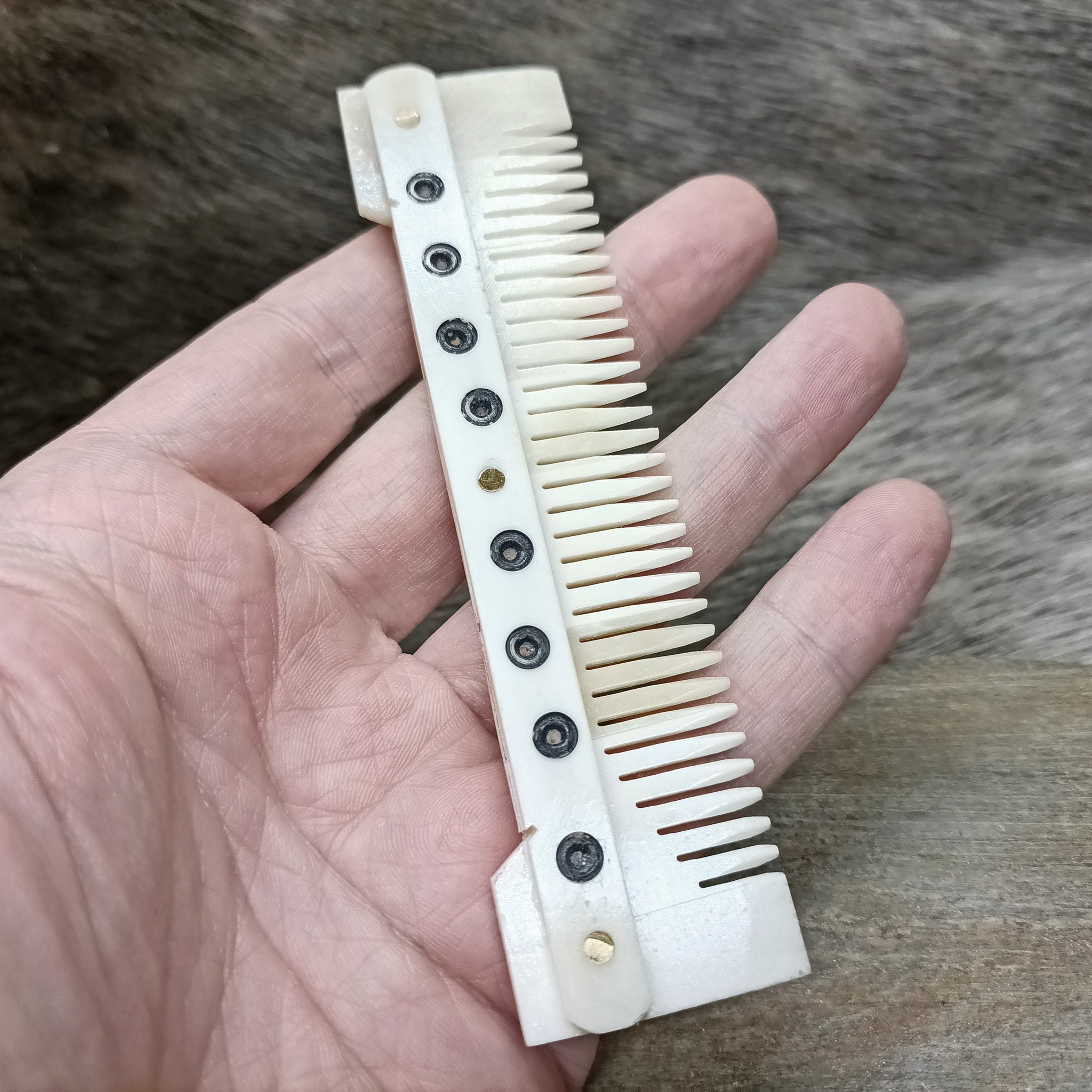 Medium Decorated Bone Viking Comb in Hand