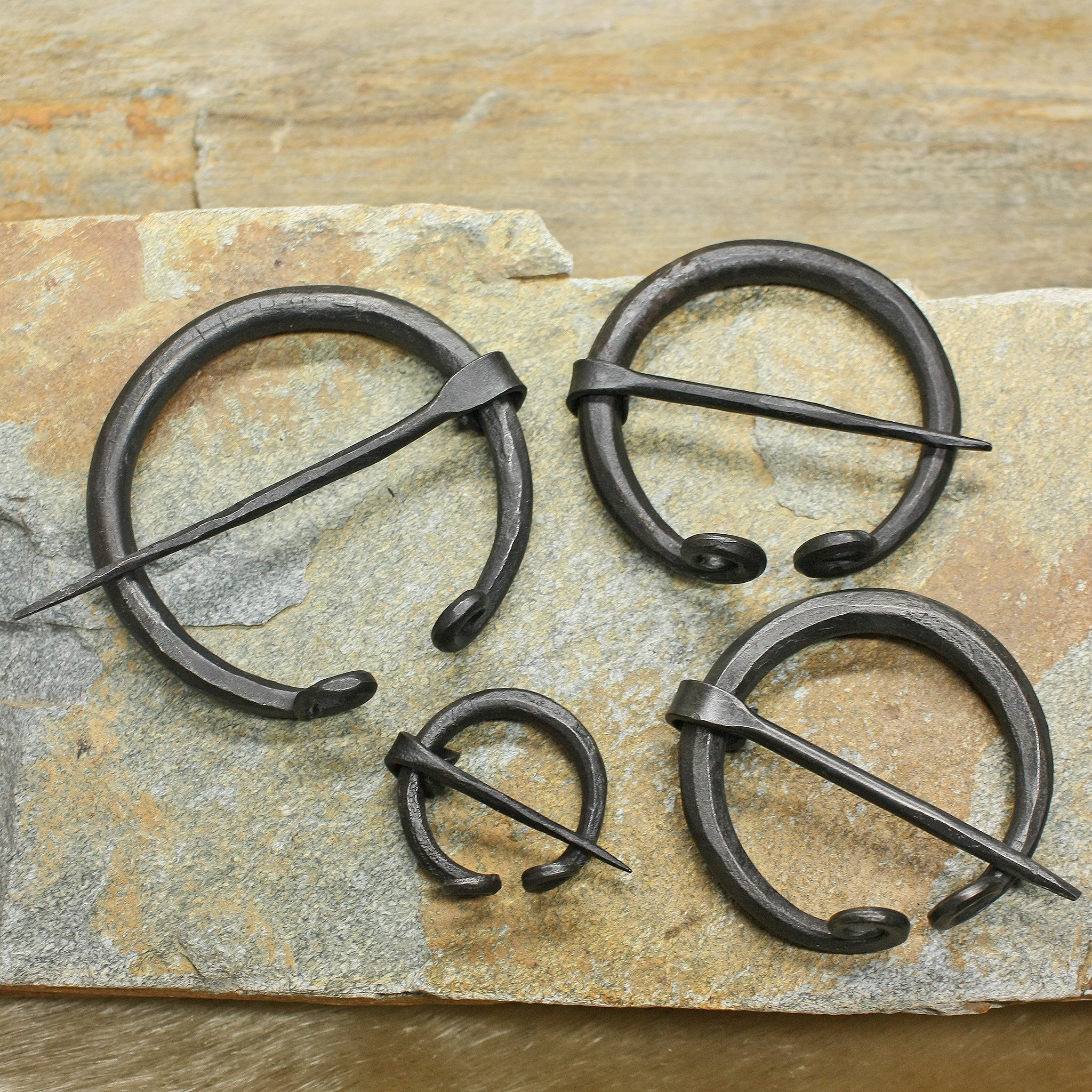 Plain Iron Penannular Brooch / Cloak Pins on Rock