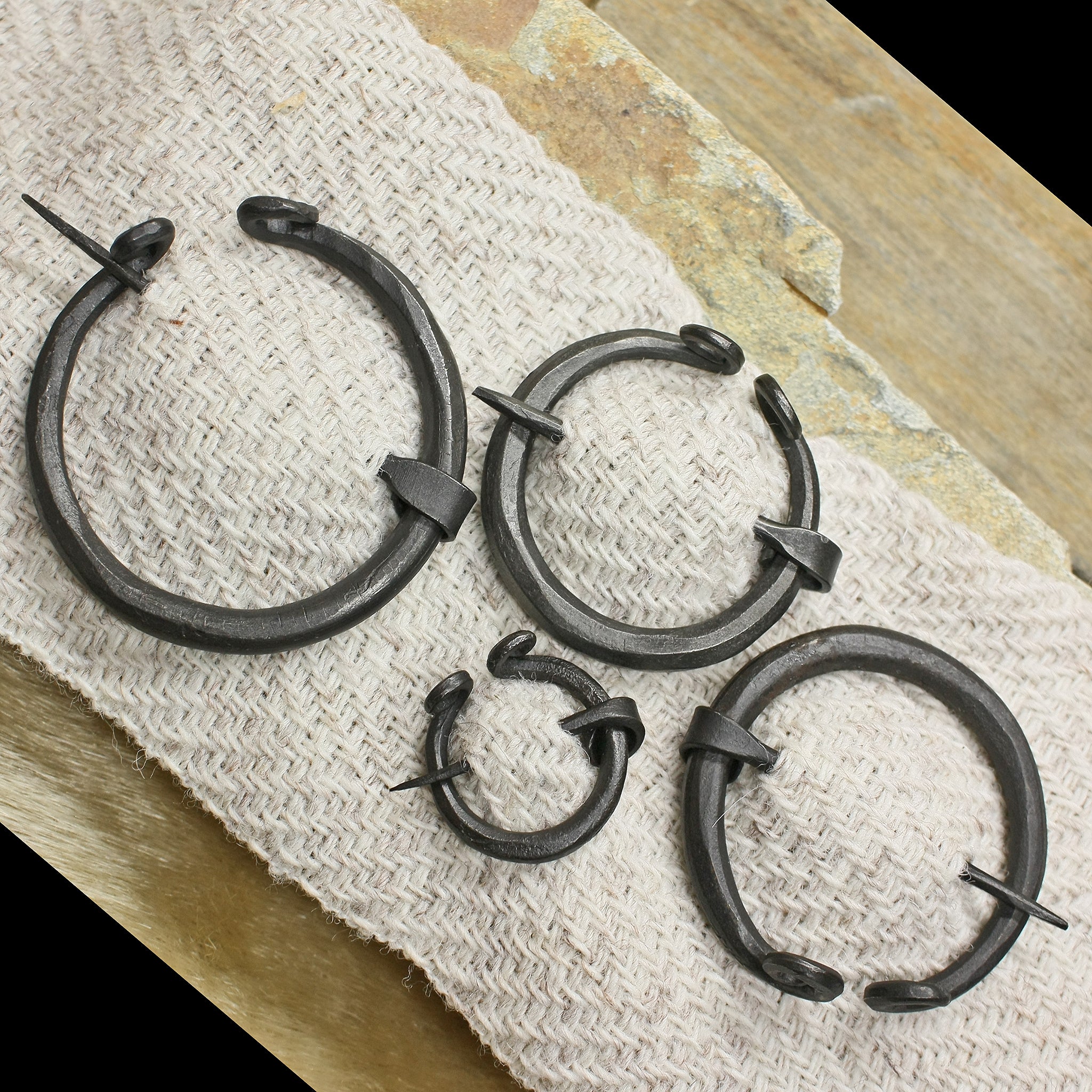 Plain Iron Penannular Brooch / Cloak Pins on Wool