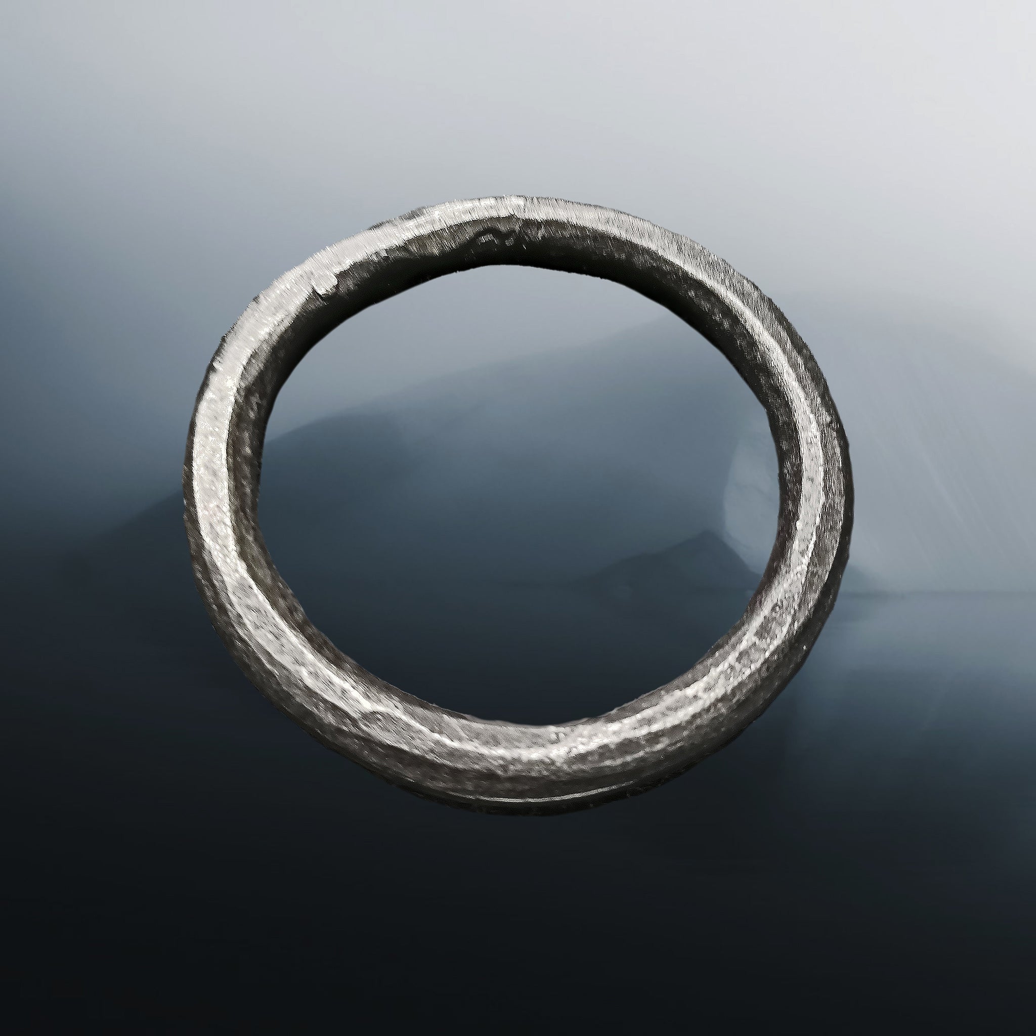 Hand-Forged Large Iron O Ring on Misty Iceberg Background