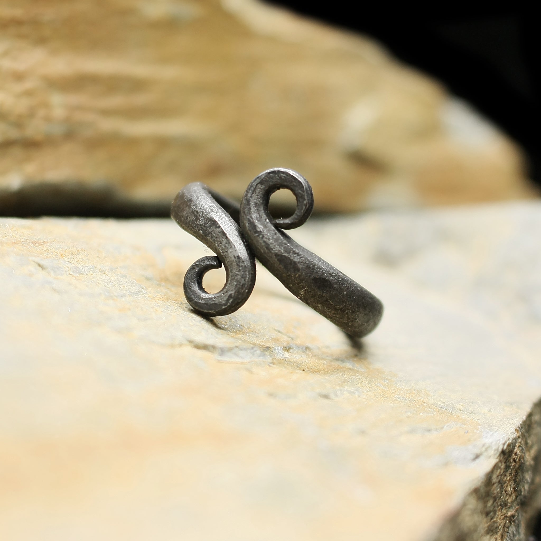 Hand-Forged Iron Viking Ring on Rock
