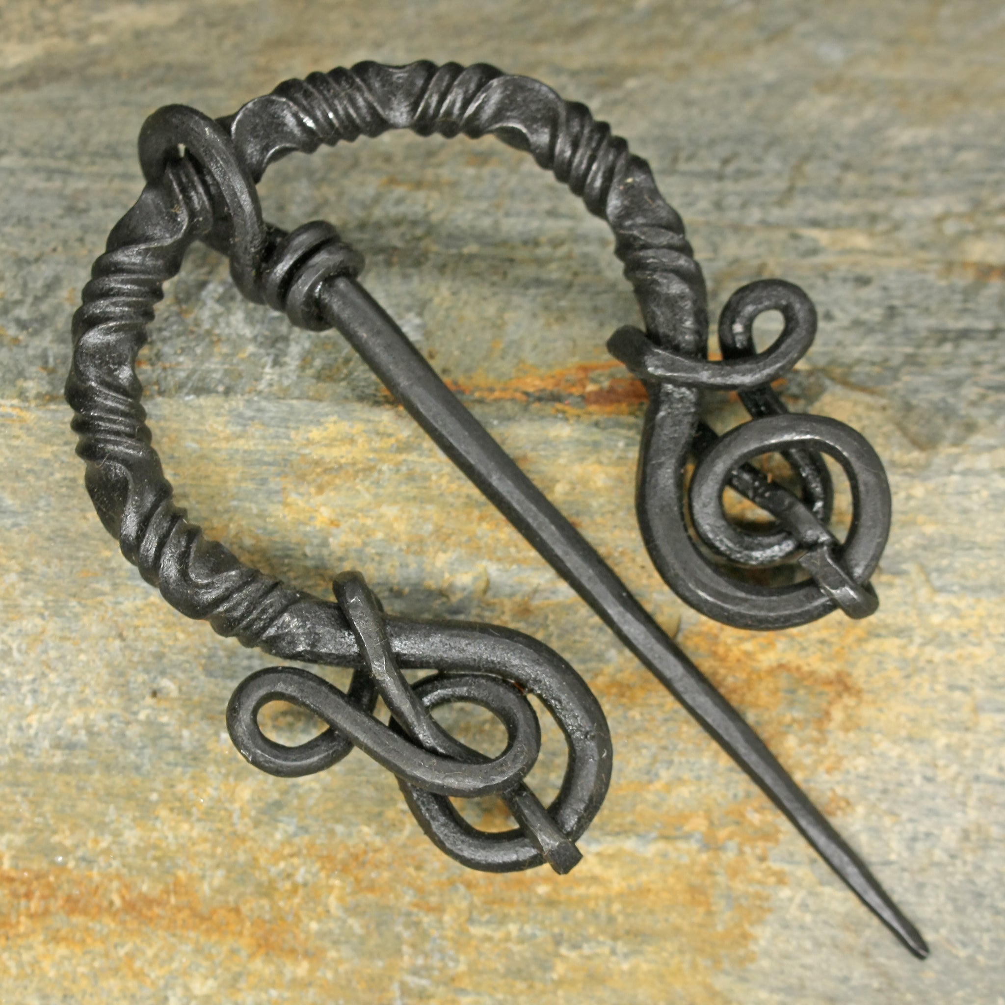 Decorated Iron Cloak Pin from Birka on Rock