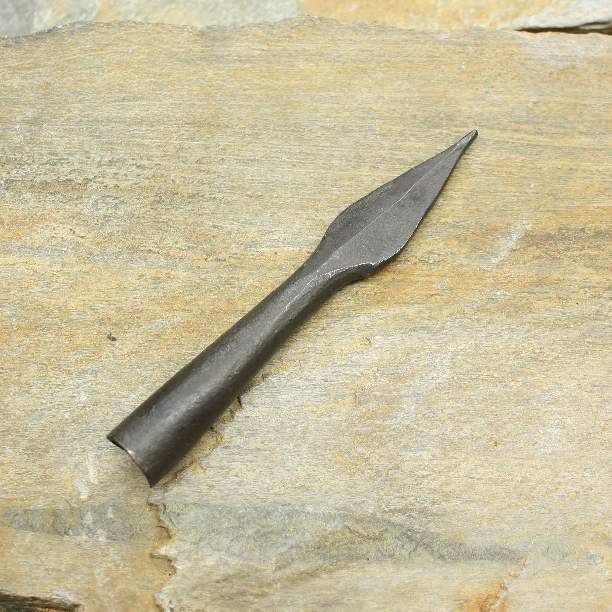 Hand-Forged Iron Arrowhead with Socket on Rock