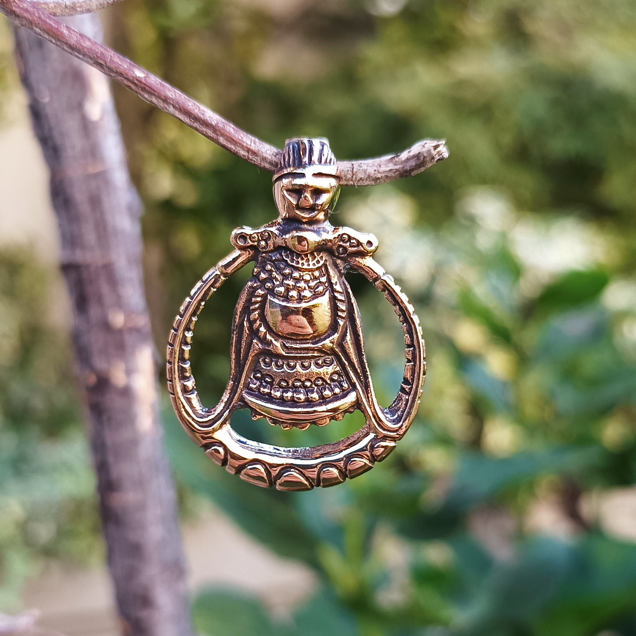 Bronze Circular Freya Pendant Hanging in Tree