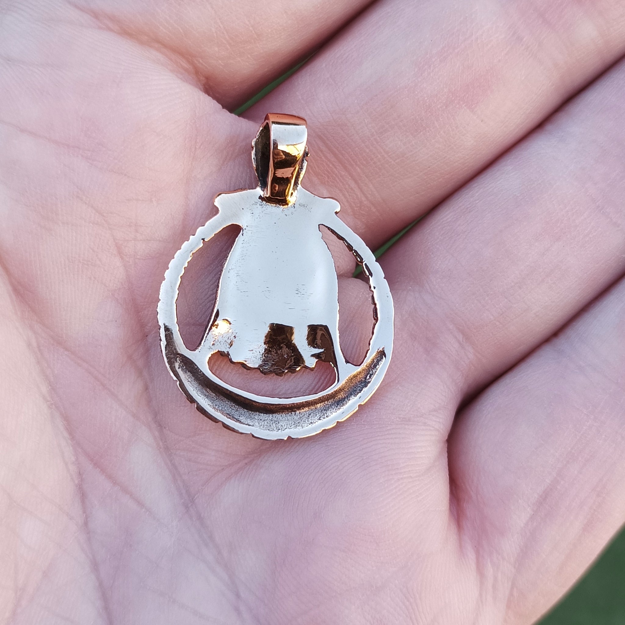 Bronze Circular Freya Pendant on Hand - Back View