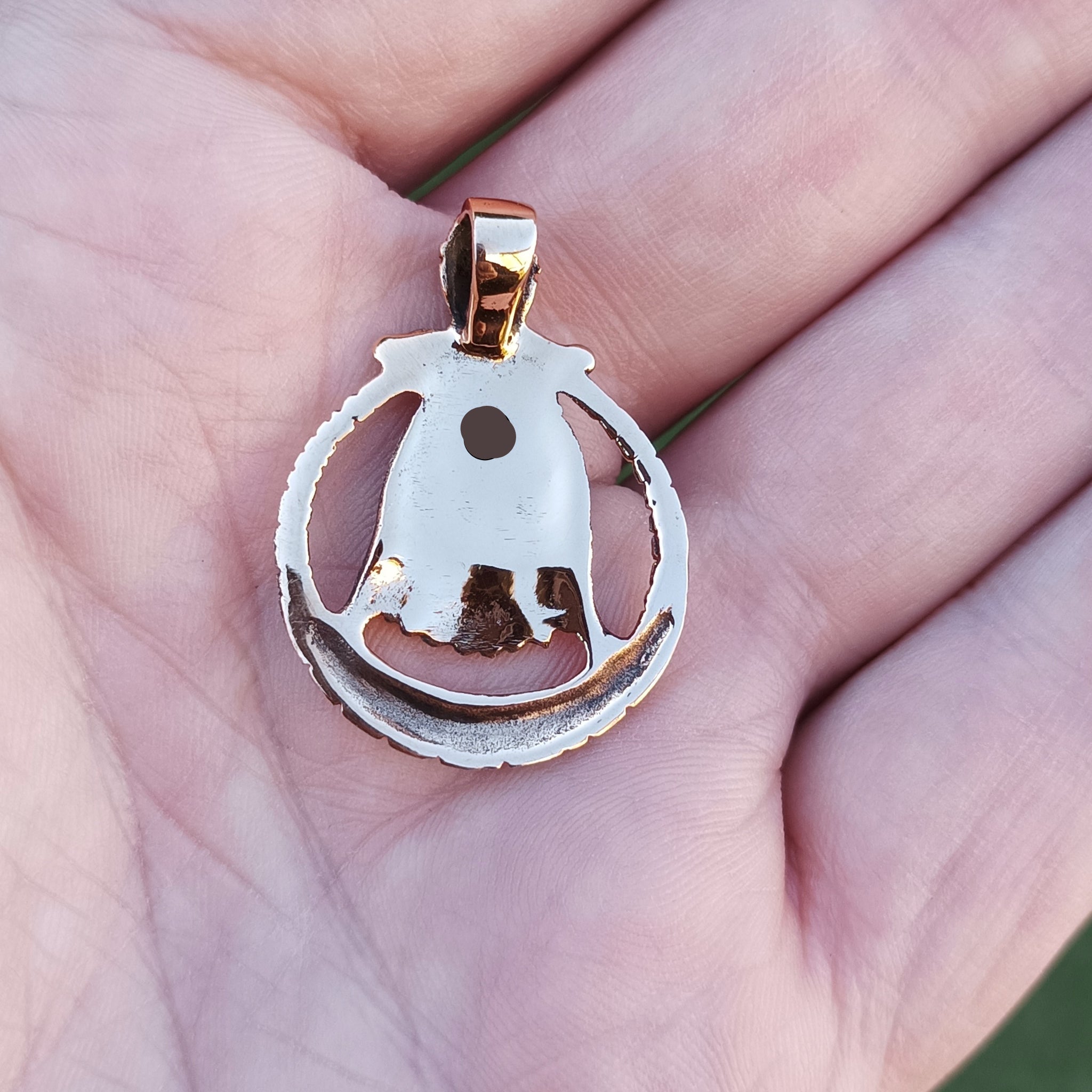 Bronze Circular Freya Pendant on Hand - Back View