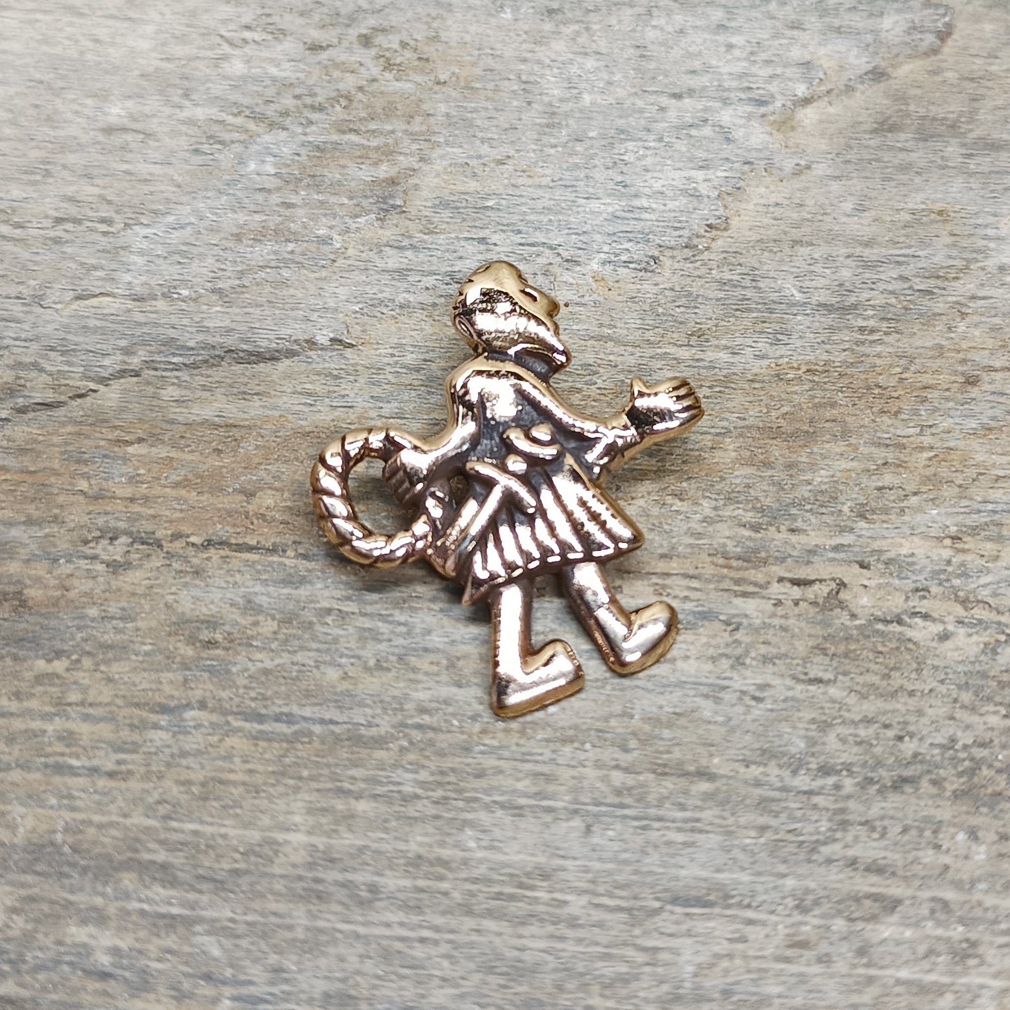 Bronze Fafnir Viking Pendant on Rock - Front Angle View
