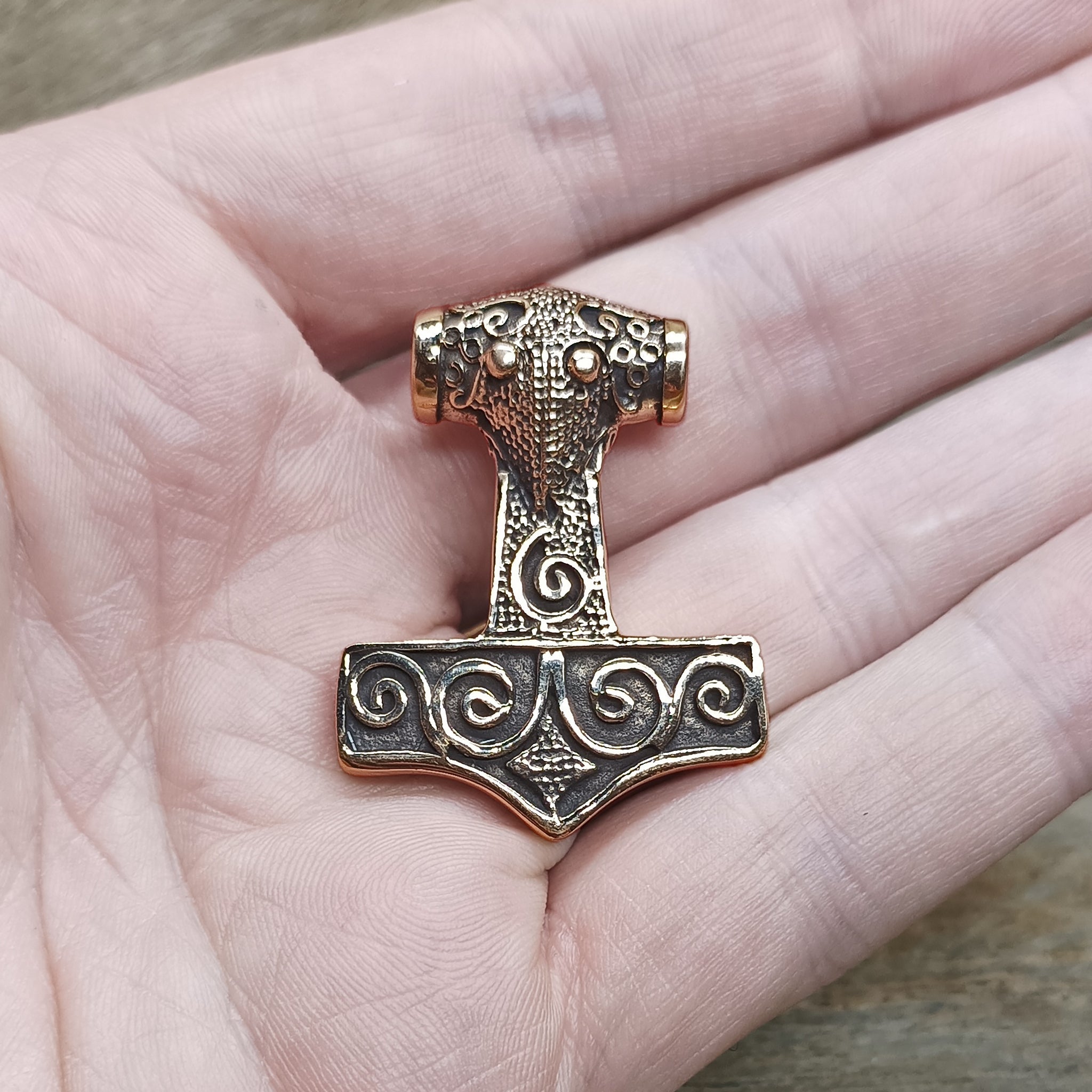 Bronze Filigree Thors Hammer Pendant From Kabara on Hand