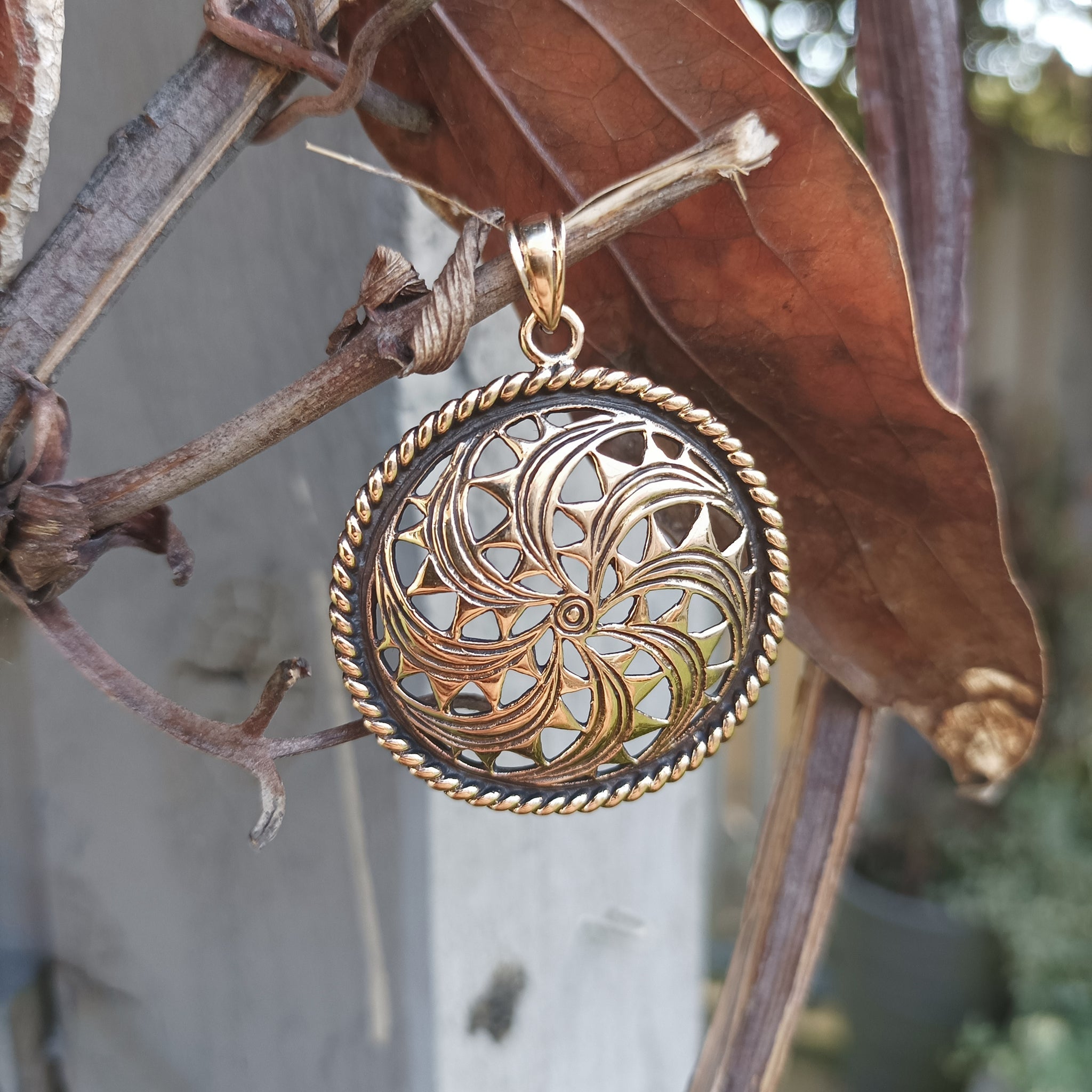 Large Bronze Sun Wheel Pendant on Tree