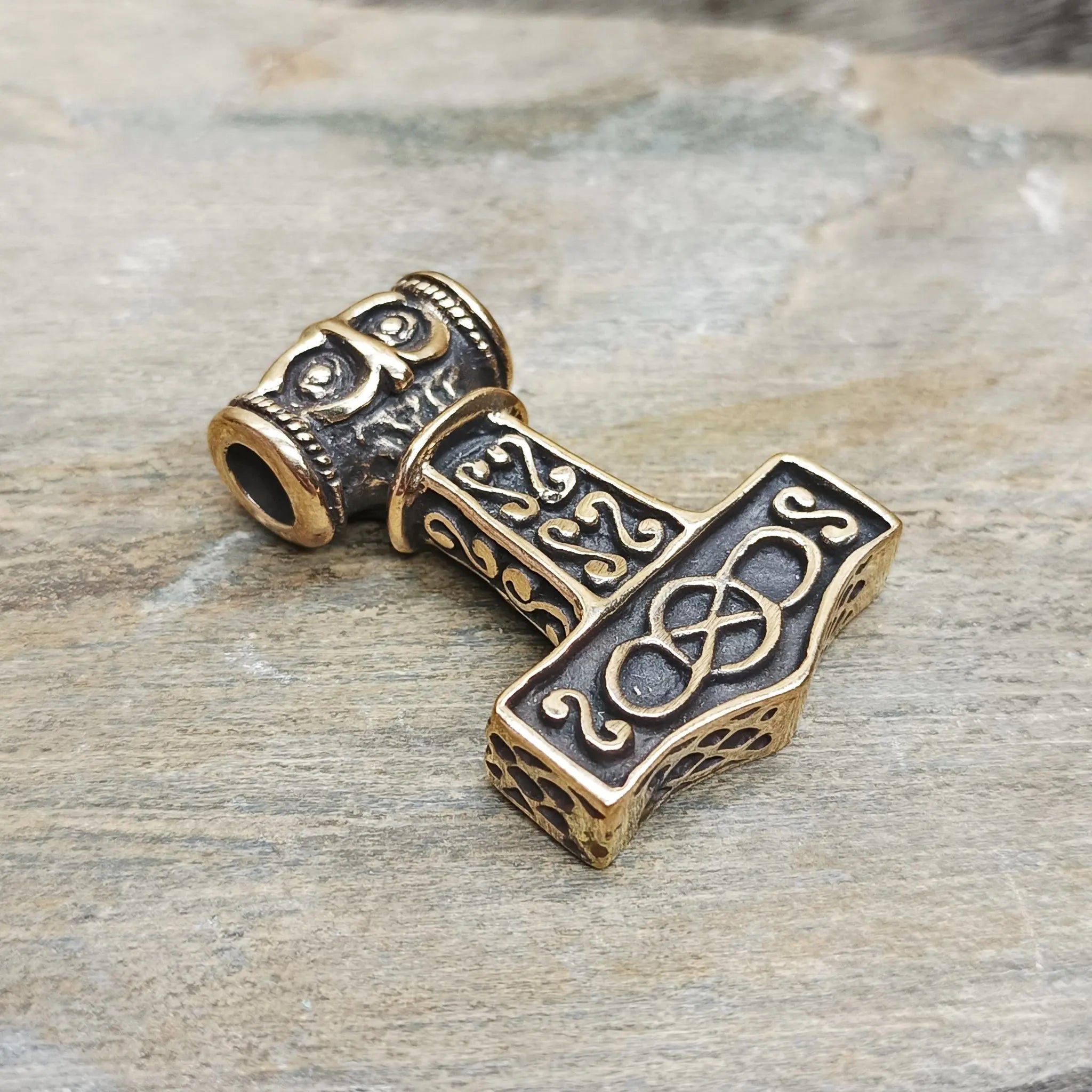 Large Bronze Thors Thunder Hammer Pendant on Rock - Front Angle View