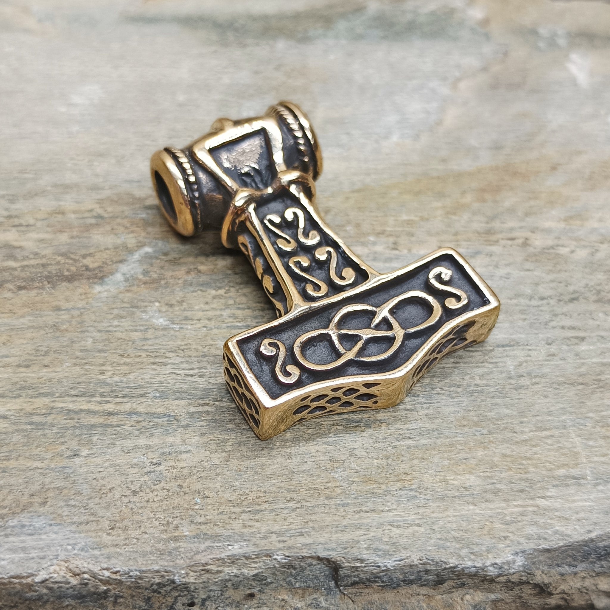 Large Bronze Thors Thunder Hammer Pendant on Rock - Back Angle View