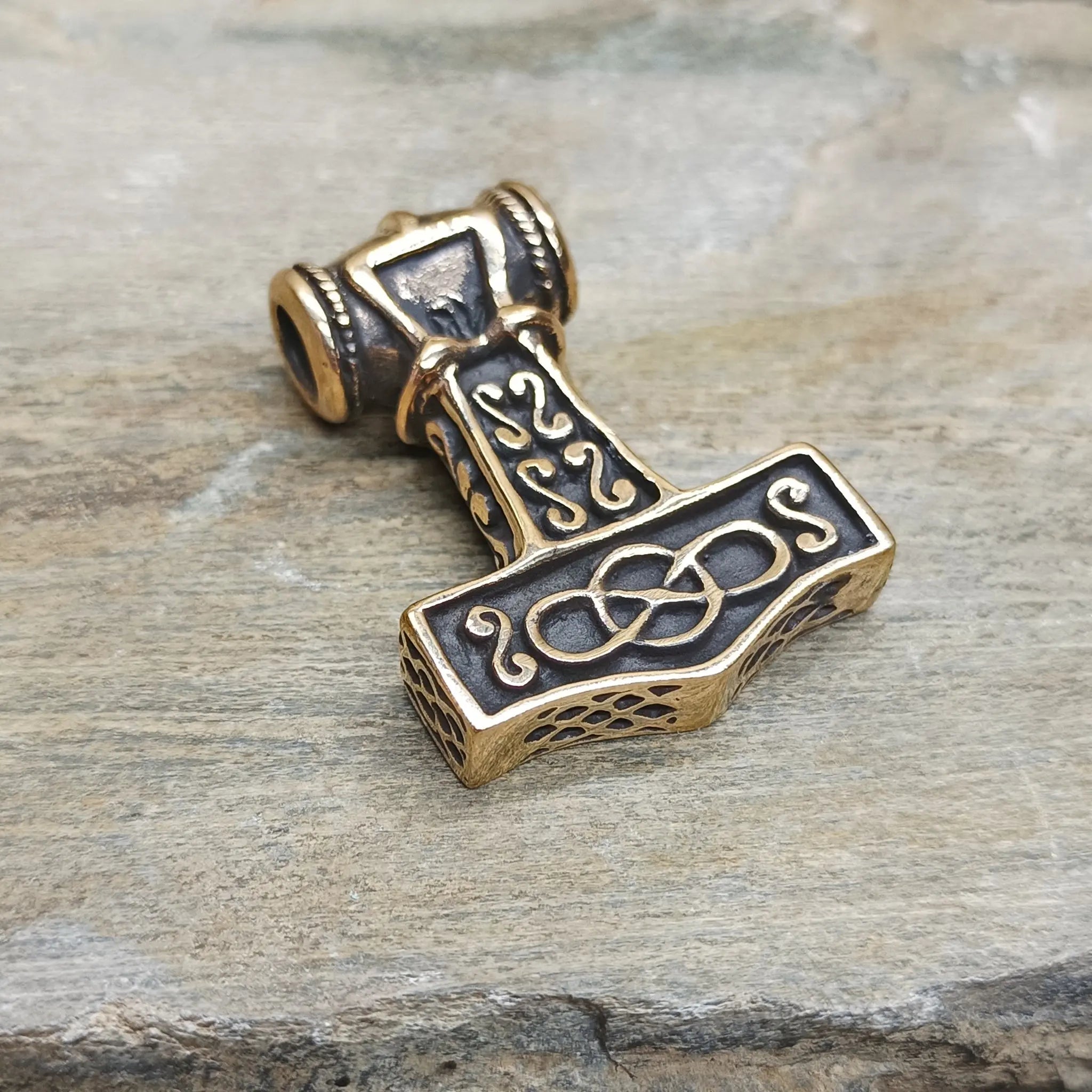 Large Bronze Thors Thunder Hammer Pendant on Rock - Back Angle View