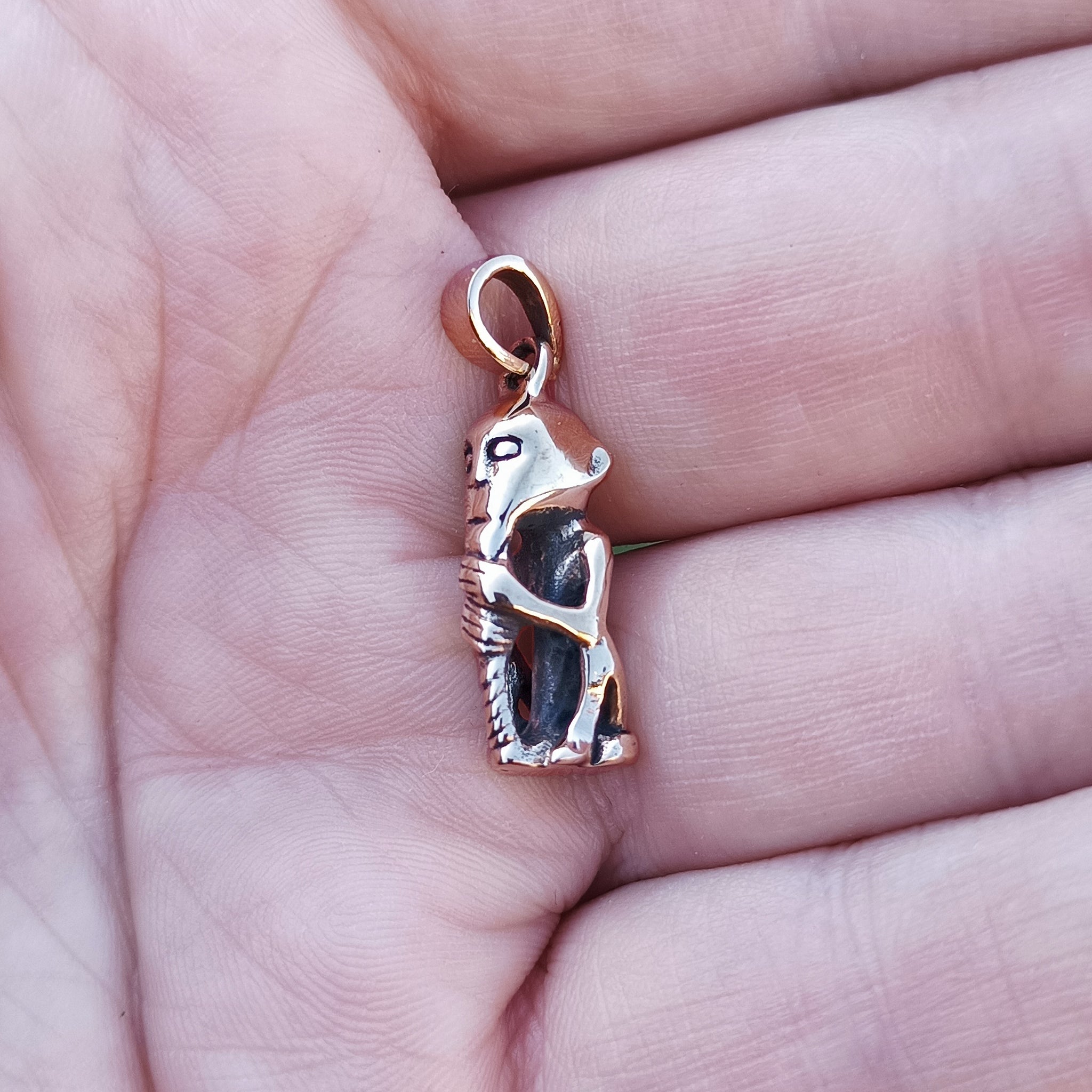 Bronze Replica Thor Pendant From Lund on Hand - Side View